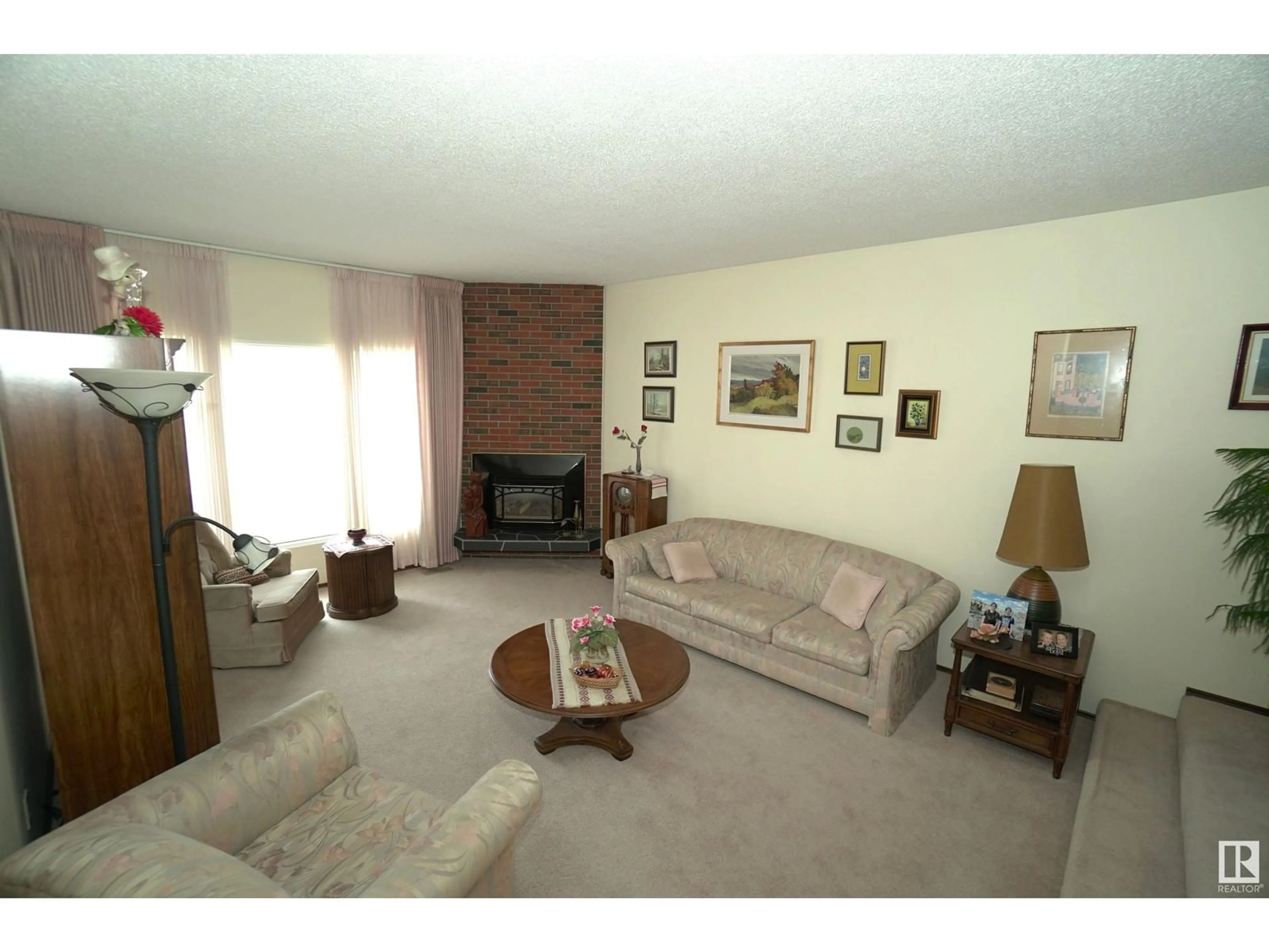 Living room with furniture, unknown for 9411 139 AV, Edmonton Alberta T5E5Z7