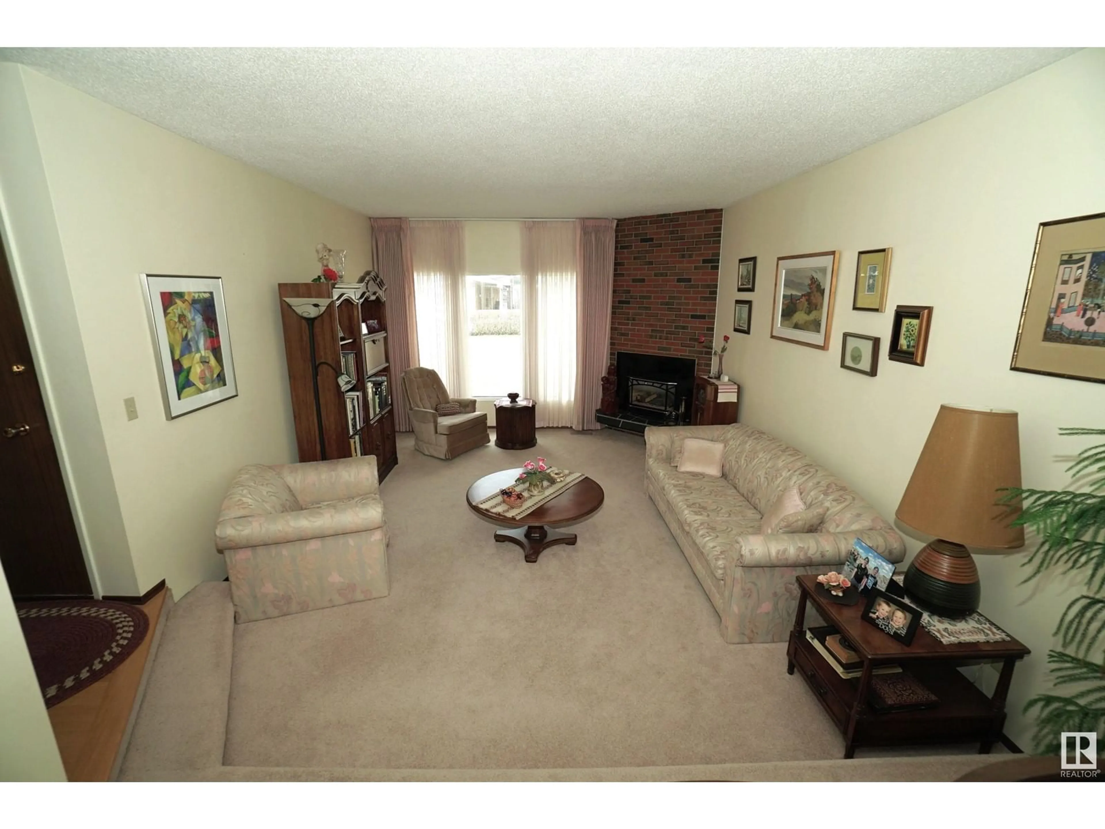 Living room with furniture, unknown for 9411 139 AV, Edmonton Alberta T5E5Z7