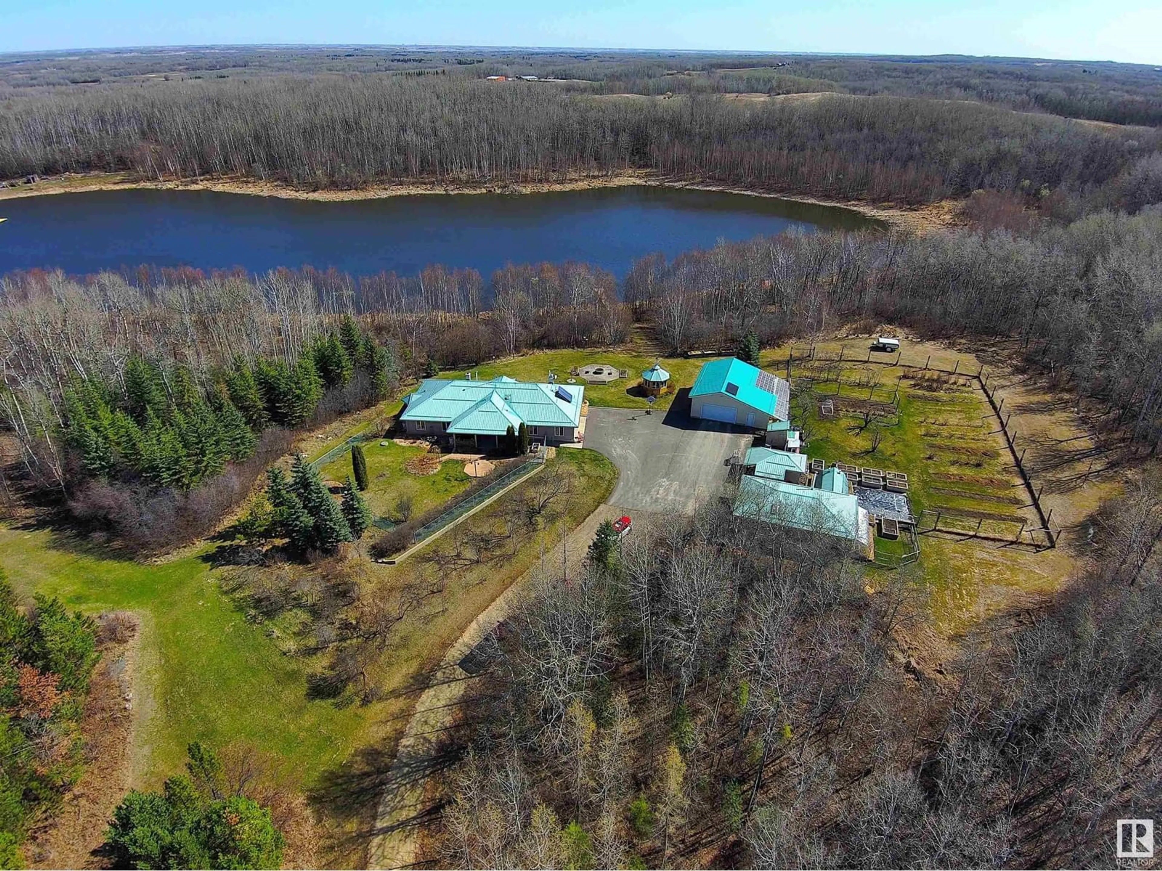 A pic from outside/outdoor area/front of a property/back of a property/a pic from drone, water/lake/river/ocean view for #212 - 54304 RGE ROAD 12, Rural Lac Ste. Anne County Alberta T0E1V2