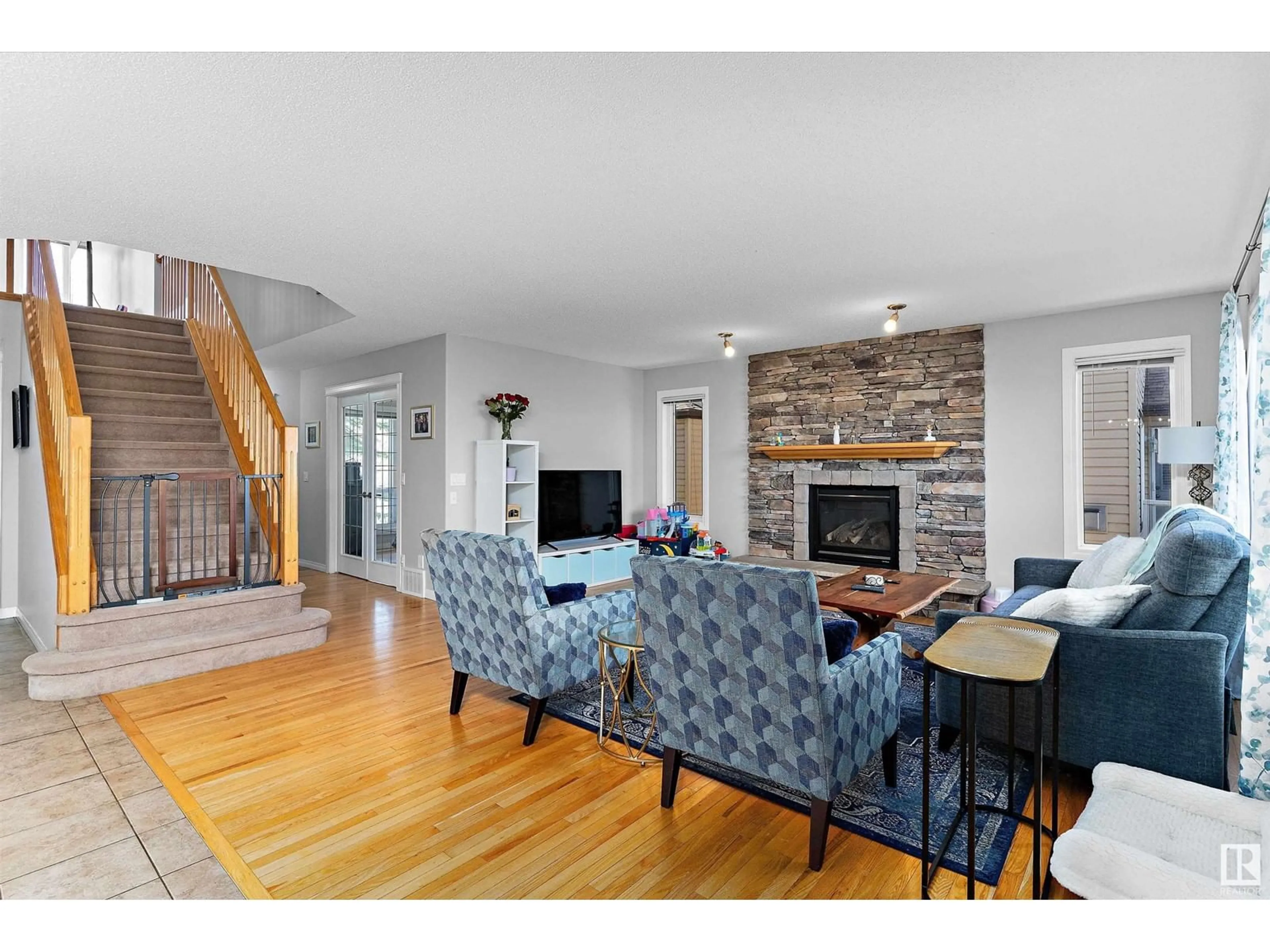 Living room with furniture, wood/laminate floor for 106 RIDEAU CR, Beaumont Alberta T4X0B9