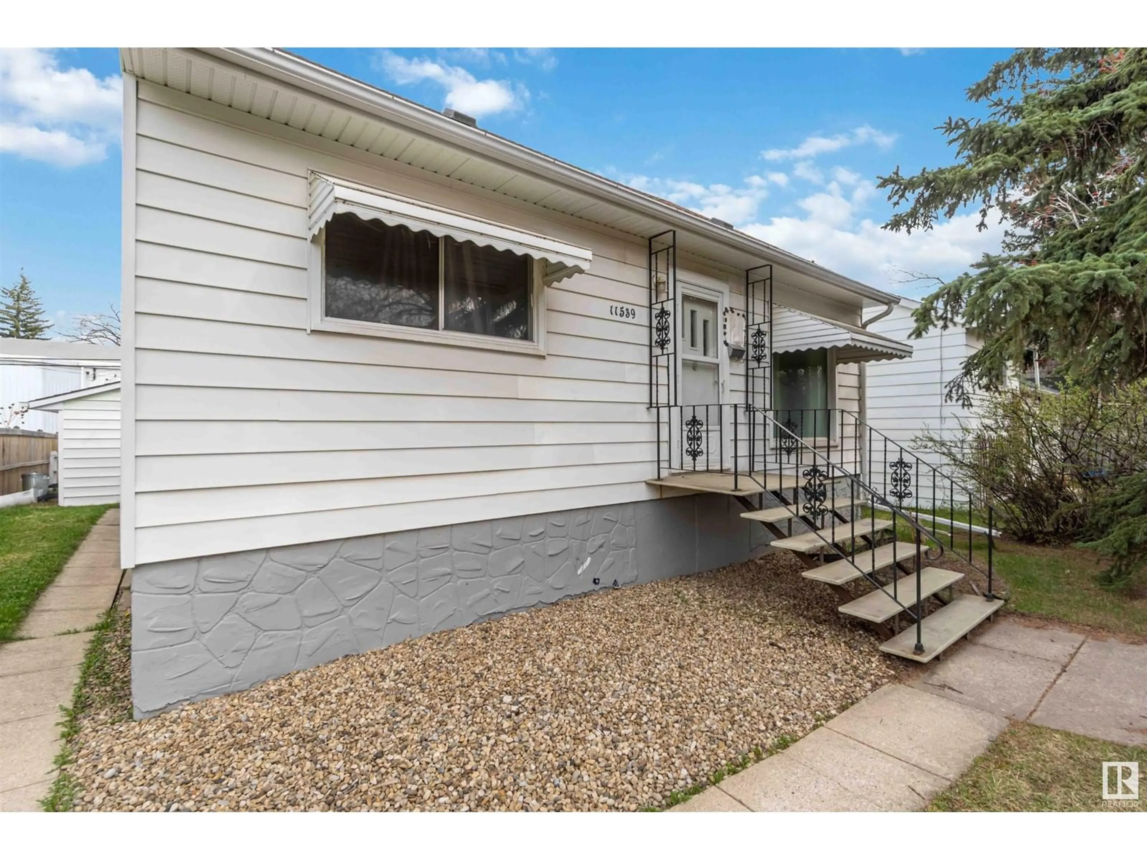 Home with vinyl exterior material, street for 11539 ST ALBERT TR, Edmonton Alberta T5M3L4