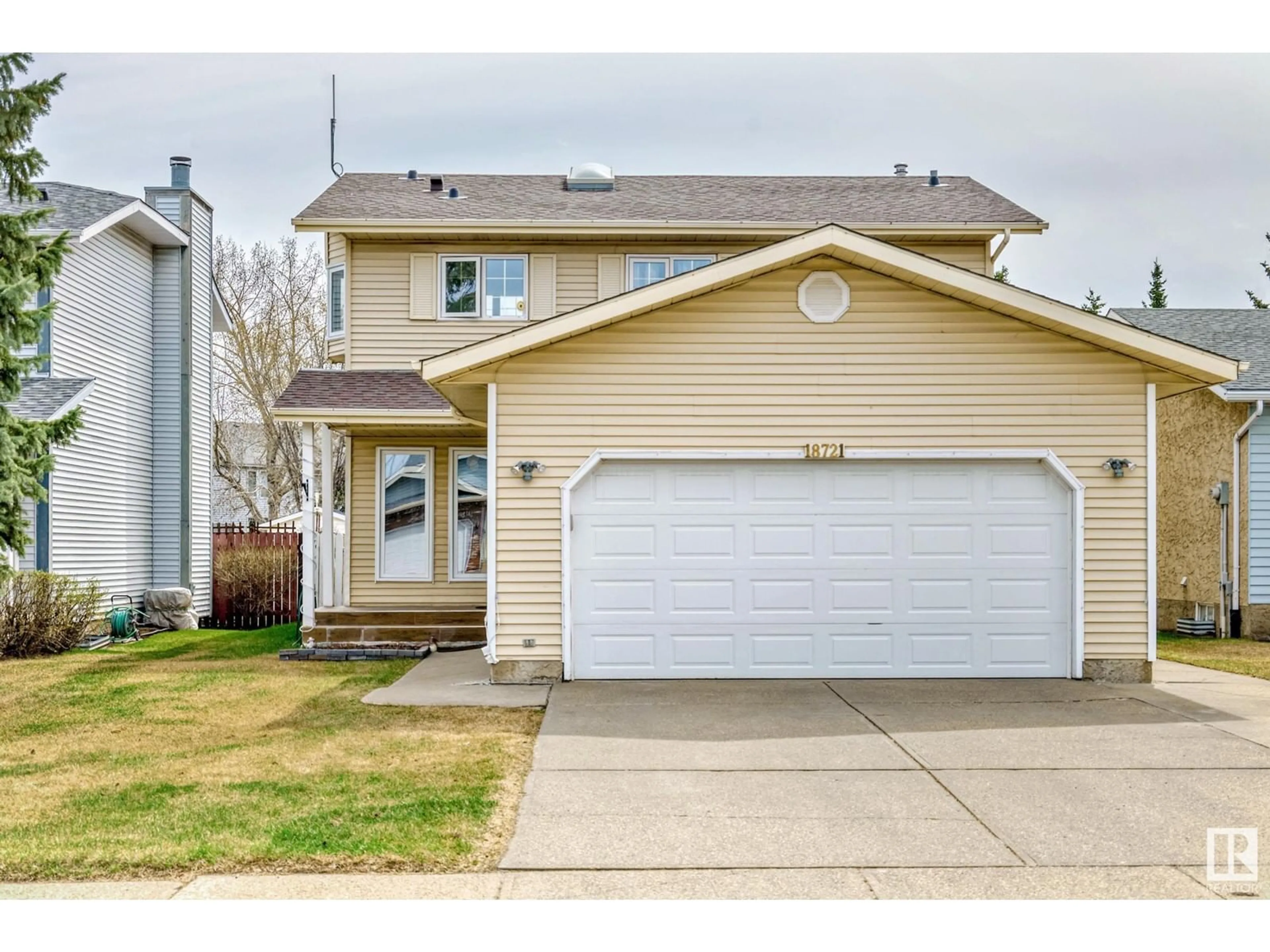 Home with vinyl exterior material, street for NW - 18721 70 AV, Edmonton Alberta T5T5C9
