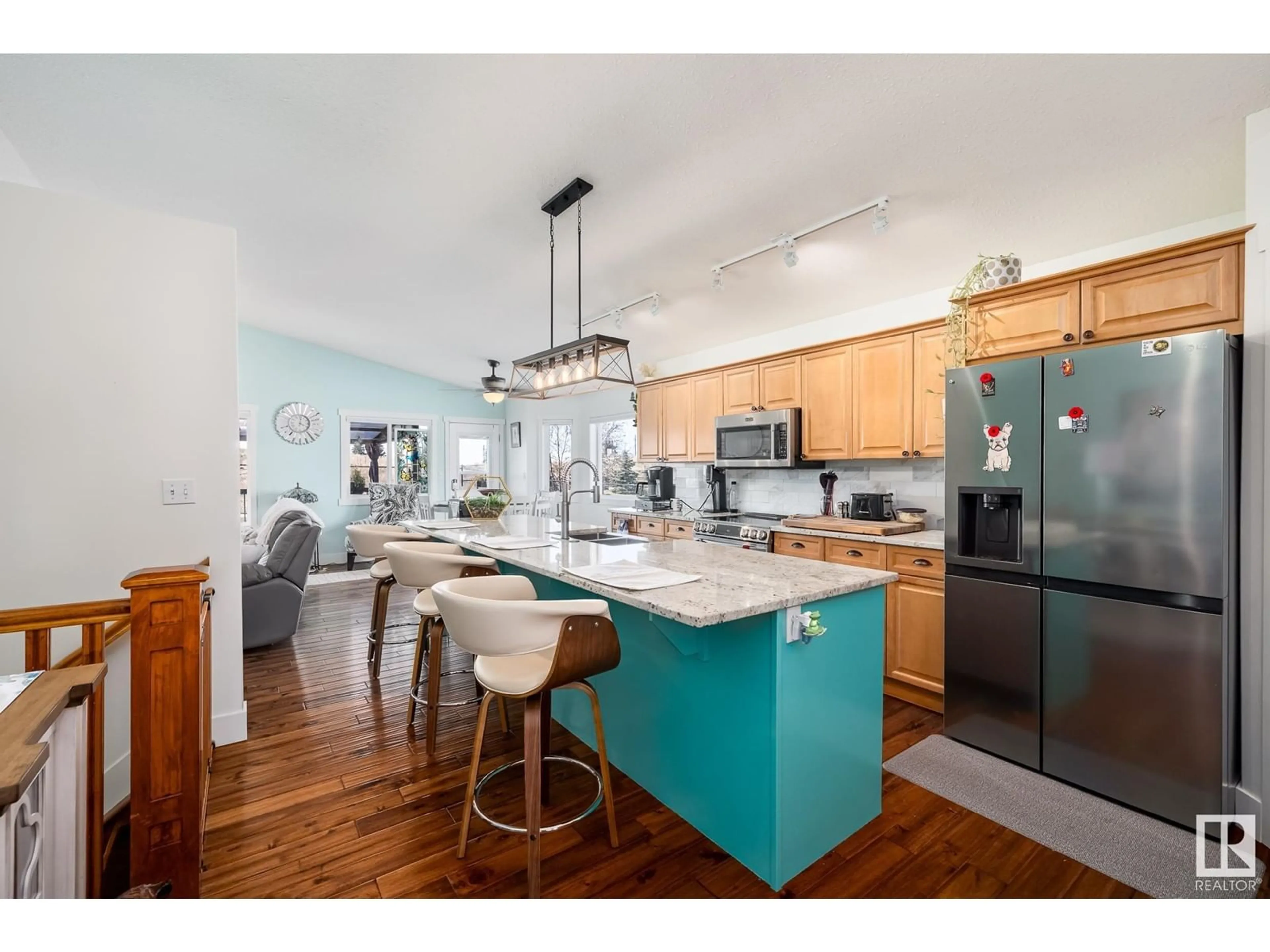 Open concept kitchen, wood/laminate floor for 67 BRIARWOOD PT, Stony Plain Alberta T7Z2Z2