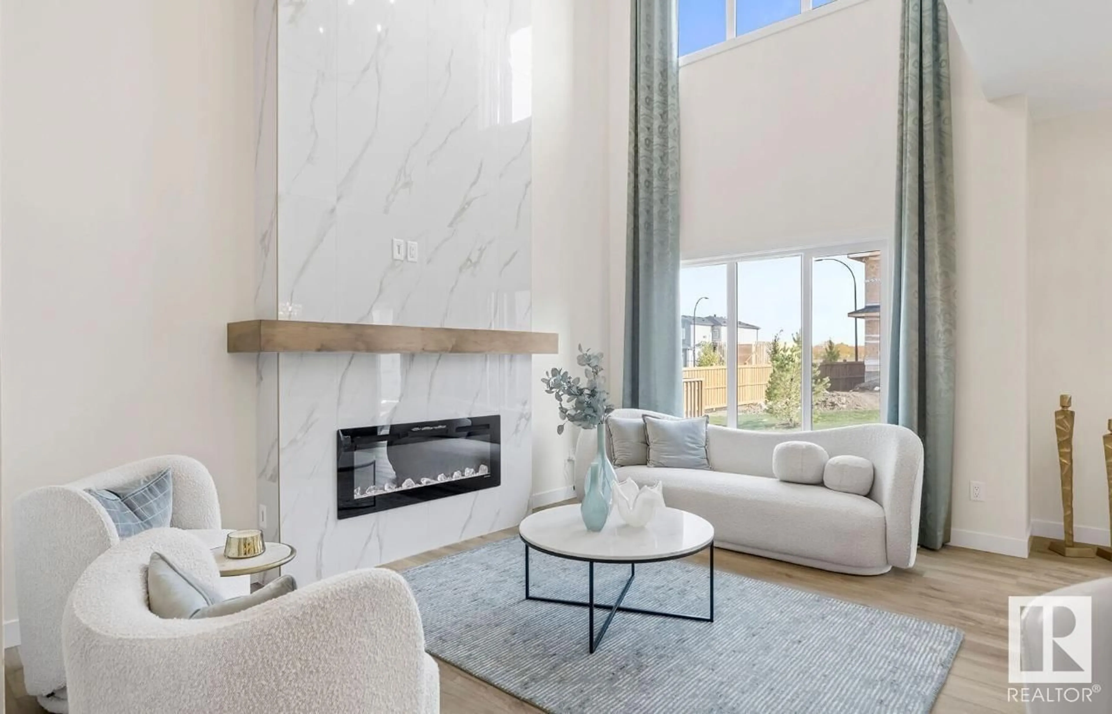 Living room with furniture, ceramic/tile floor for 304 JUNIPER CV, Leduc Alberta T9E1S7