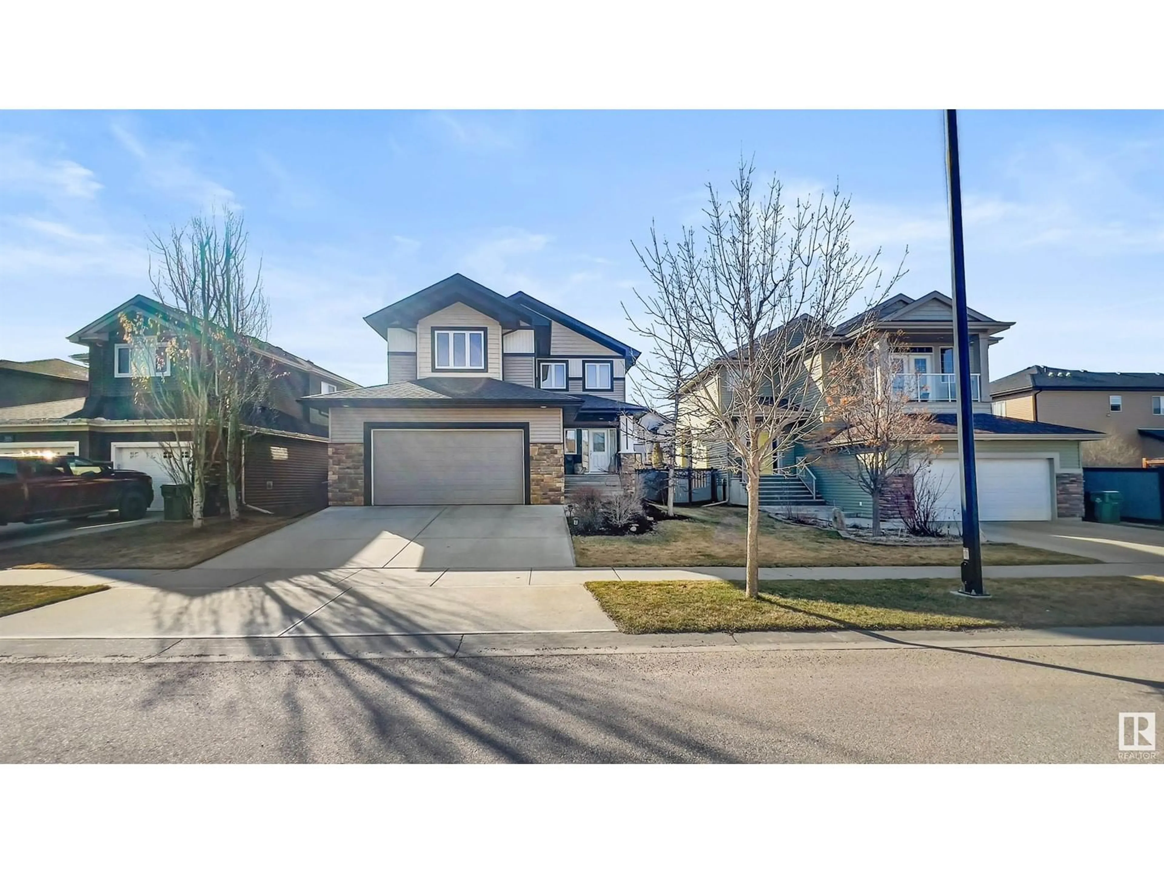 A pic from outside/outdoor area/front of a property/back of a property/a pic from drone, street for 303 BRIDGEPORT PL, Leduc Alberta T9E0M2