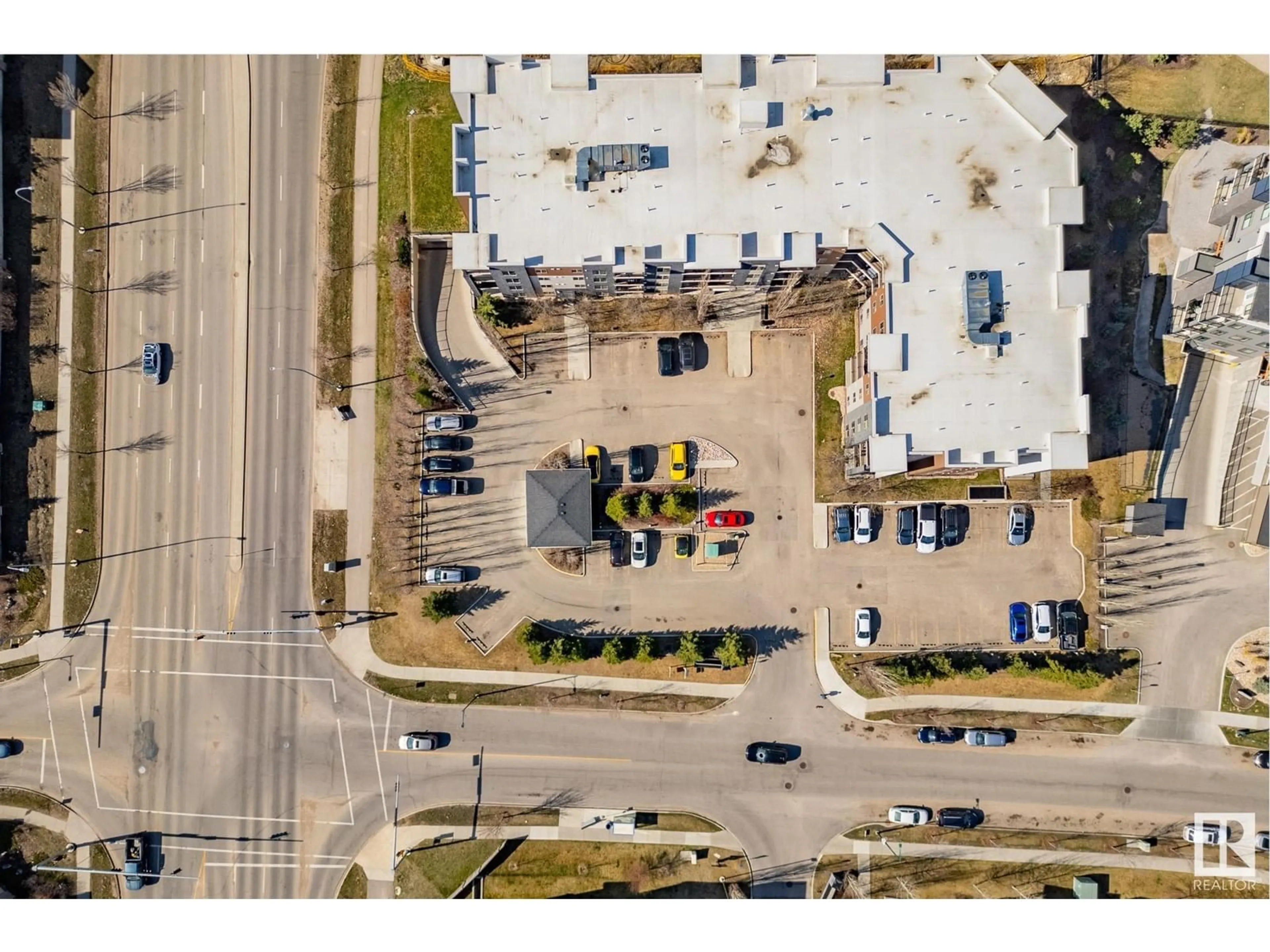 A pic from outside/outdoor area/front of a property/back of a property/a pic from drone, street for #107 - 11803 22 AV, Edmonton Alberta T6W2R9