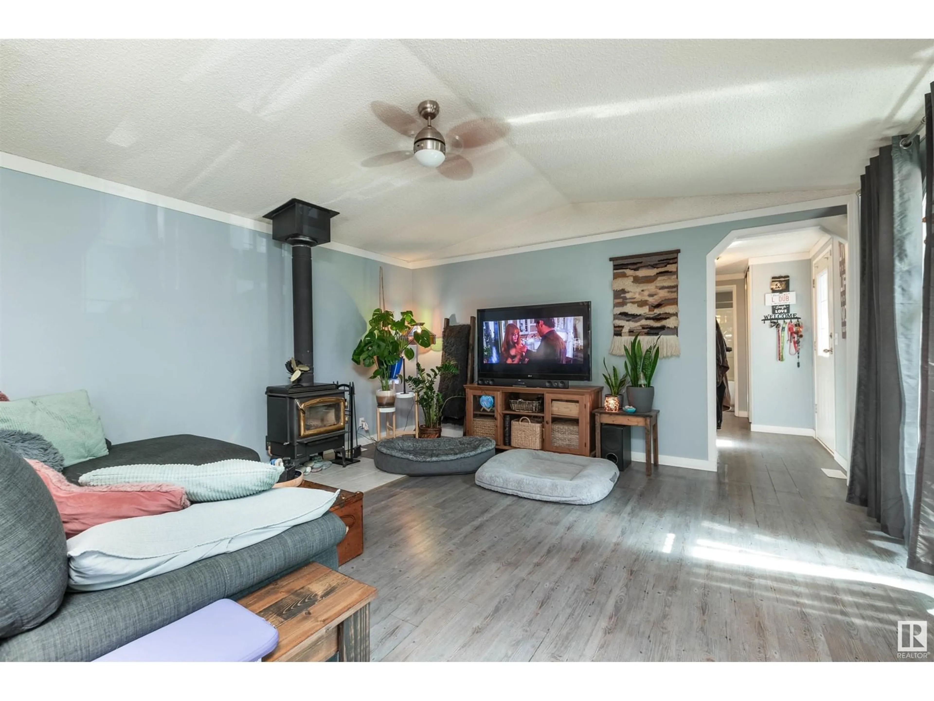 Living room with furniture, wood/laminate floor for 575014 RG RD 181, Rural Lamont County Alberta T0B2R0