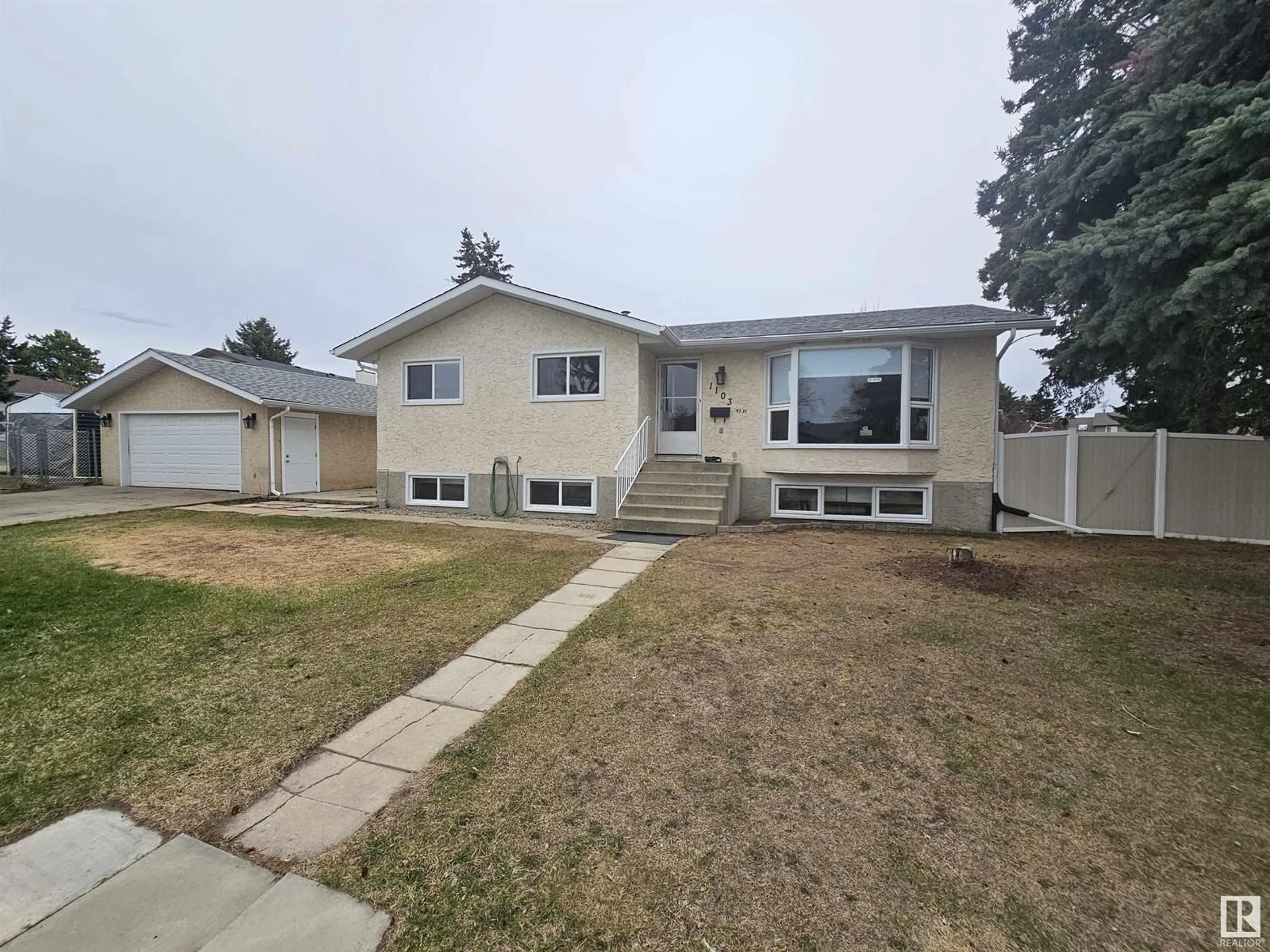 Home with vinyl exterior material, street for 1103 41 ST, Edmonton Alberta T6L2K3