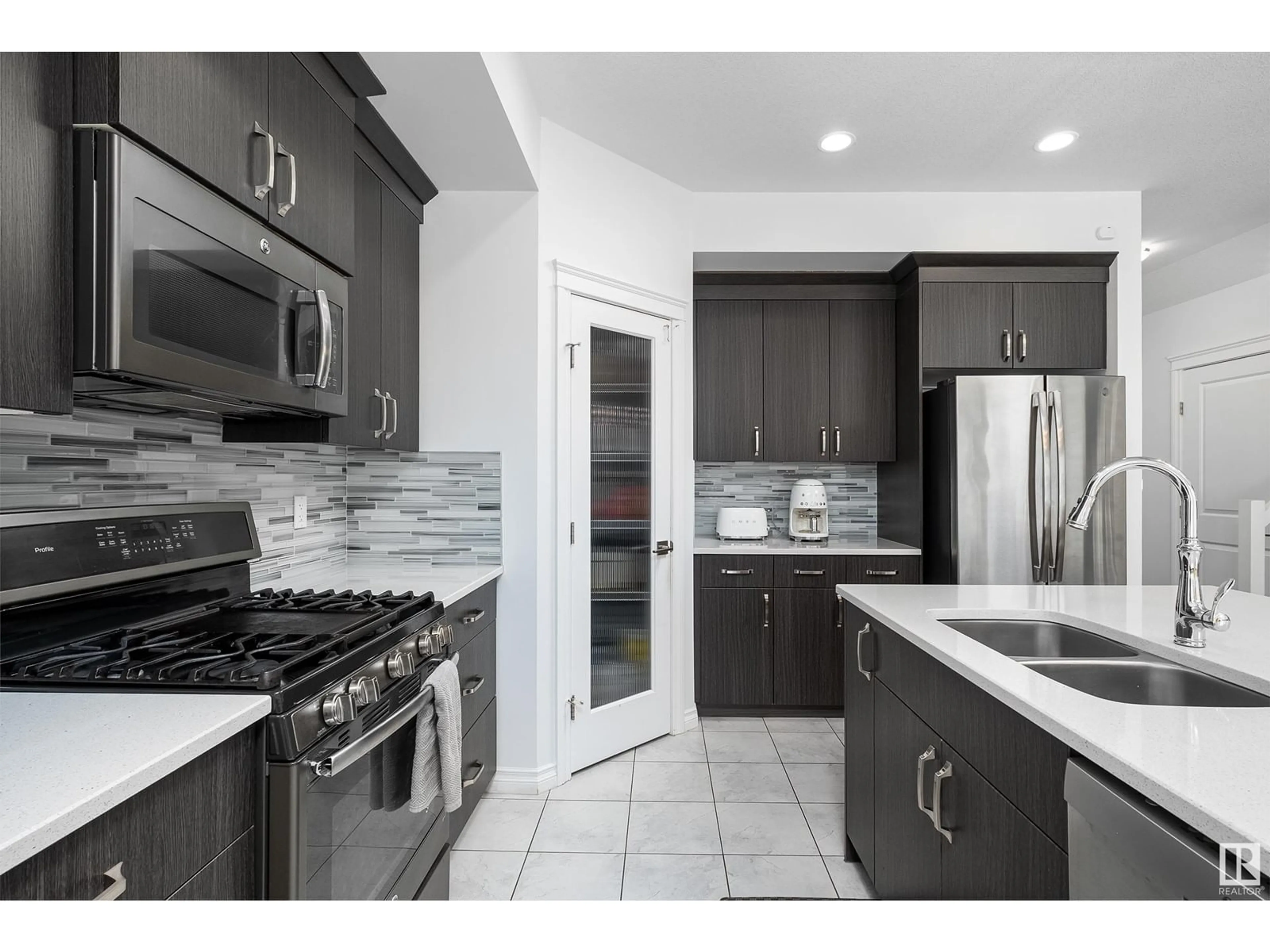 Contemporary kitchen, ceramic/tile floor for 203 SIMPKINS BN, Leduc Alberta T9E0E8