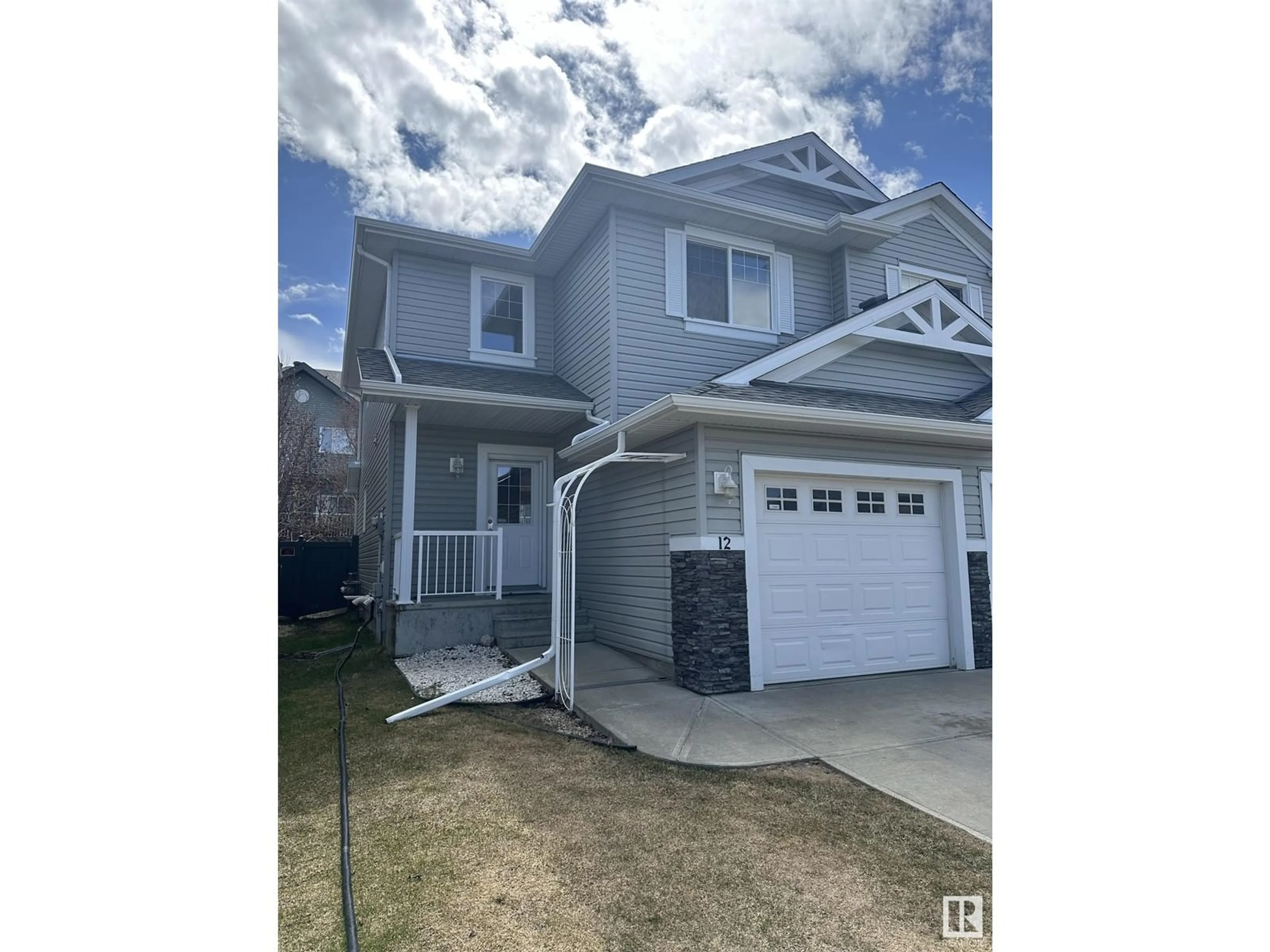 Home with vinyl exterior material, street for 12 5101 SOLEIL BV, Beaumont Alberta T4X0E3