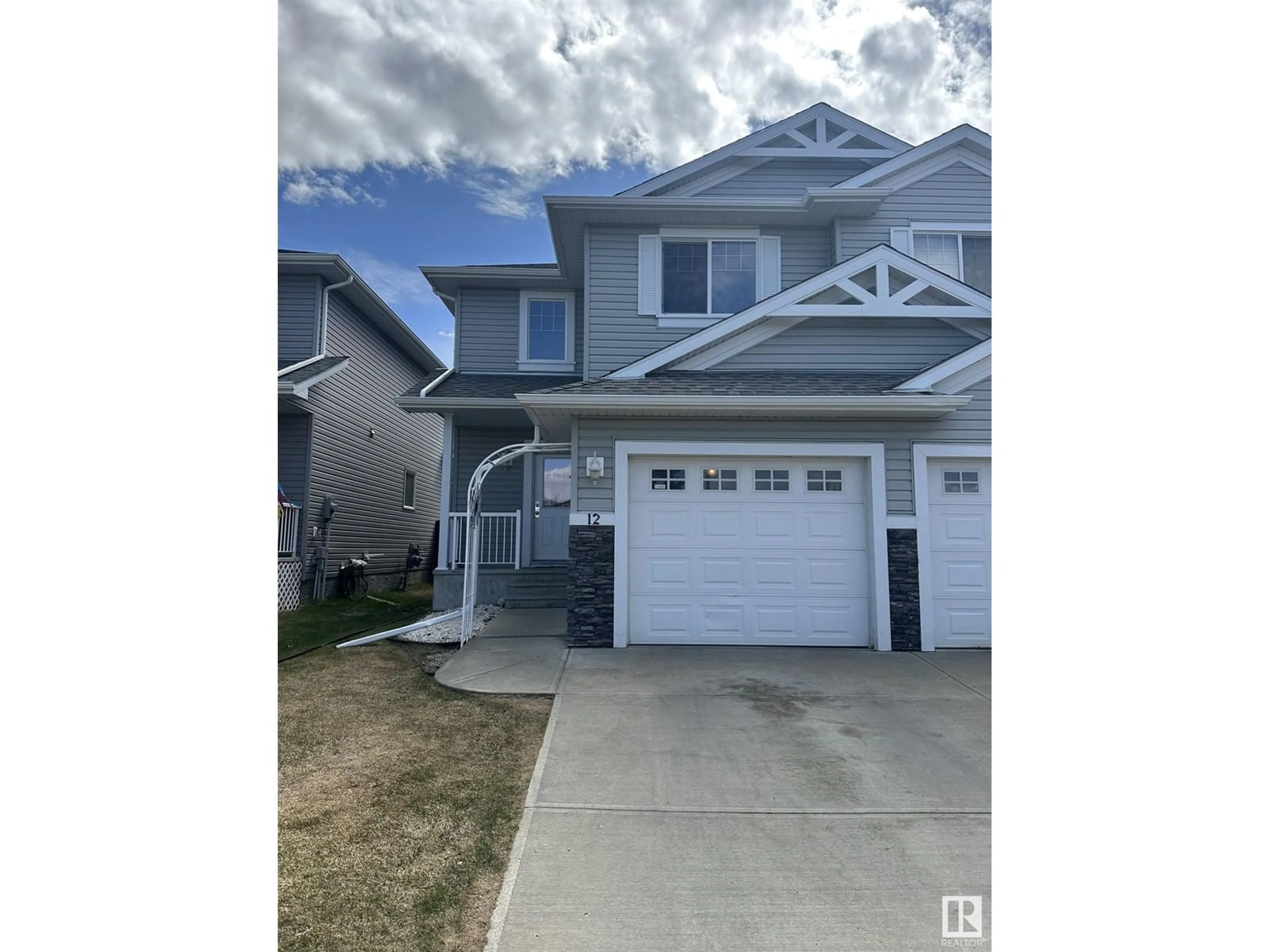 Home with vinyl exterior material, street for 12 5101 SOLEIL BV, Beaumont Alberta T4X0E3