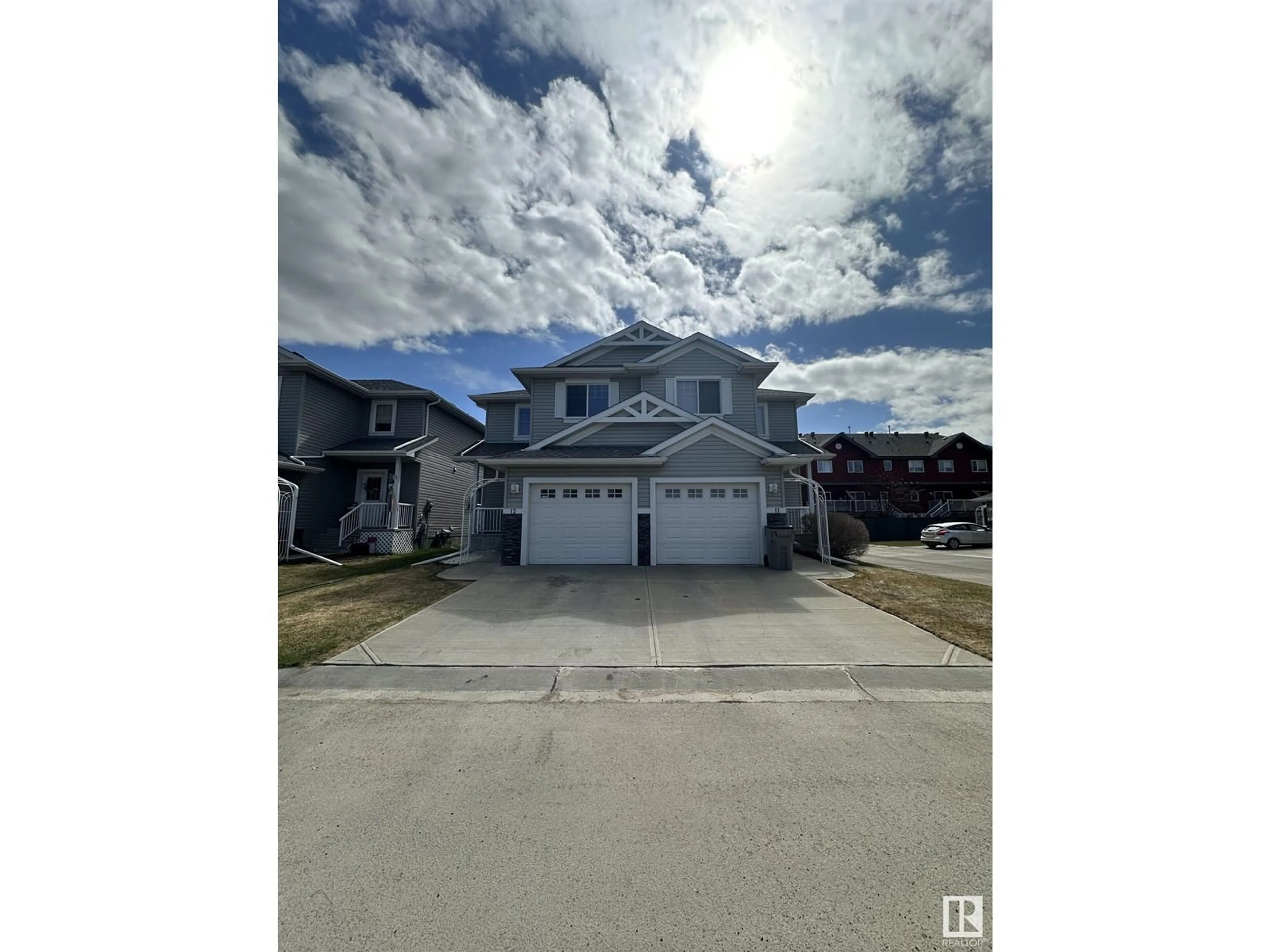 A pic from outside/outdoor area/front of a property/back of a property/a pic from drone, street for 12 5101 SOLEIL BV, Beaumont Alberta T4X0E3