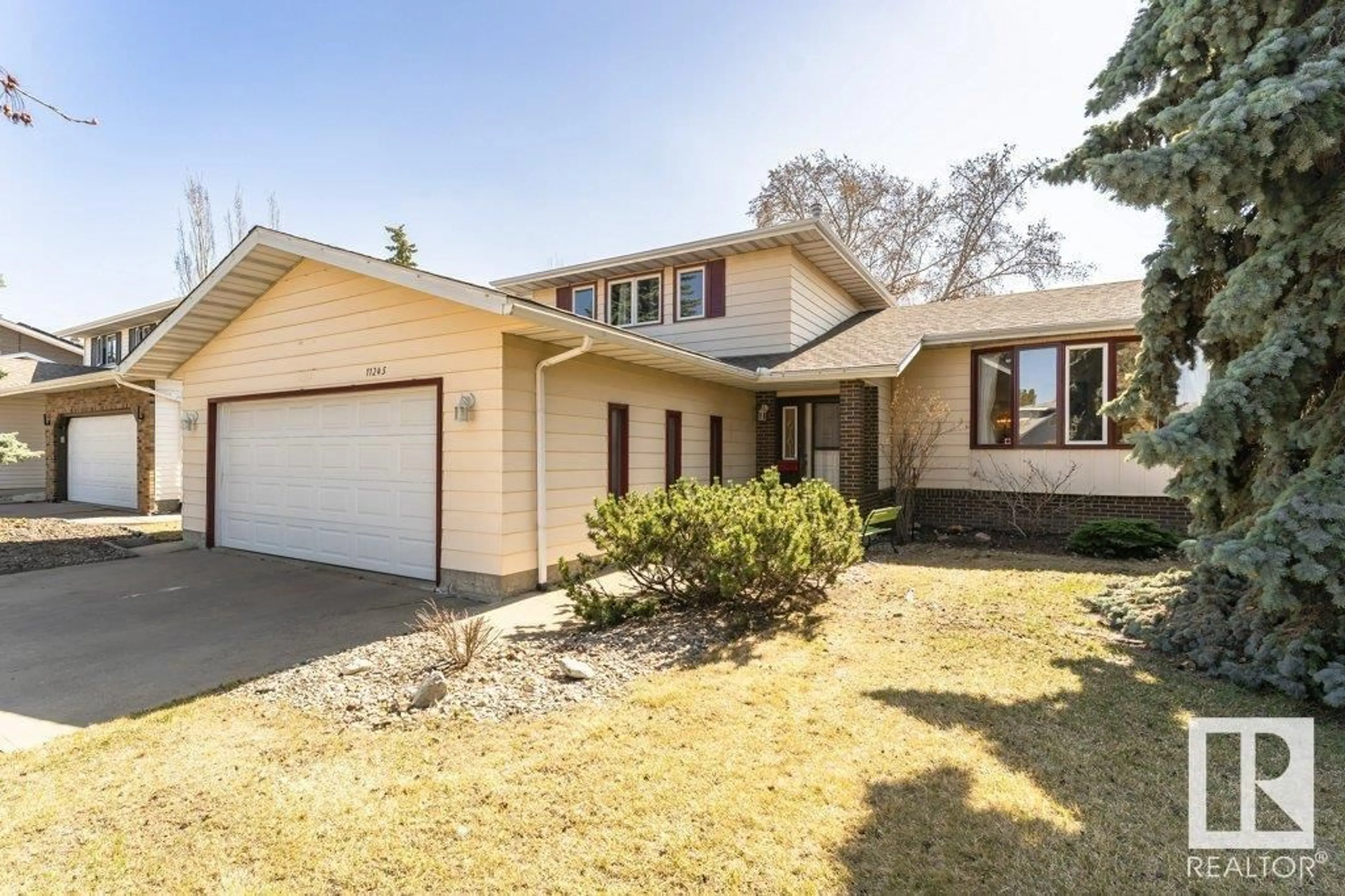 Home with vinyl exterior material, street for NW - 11245 34A AV, Edmonton Alberta T6J3N5