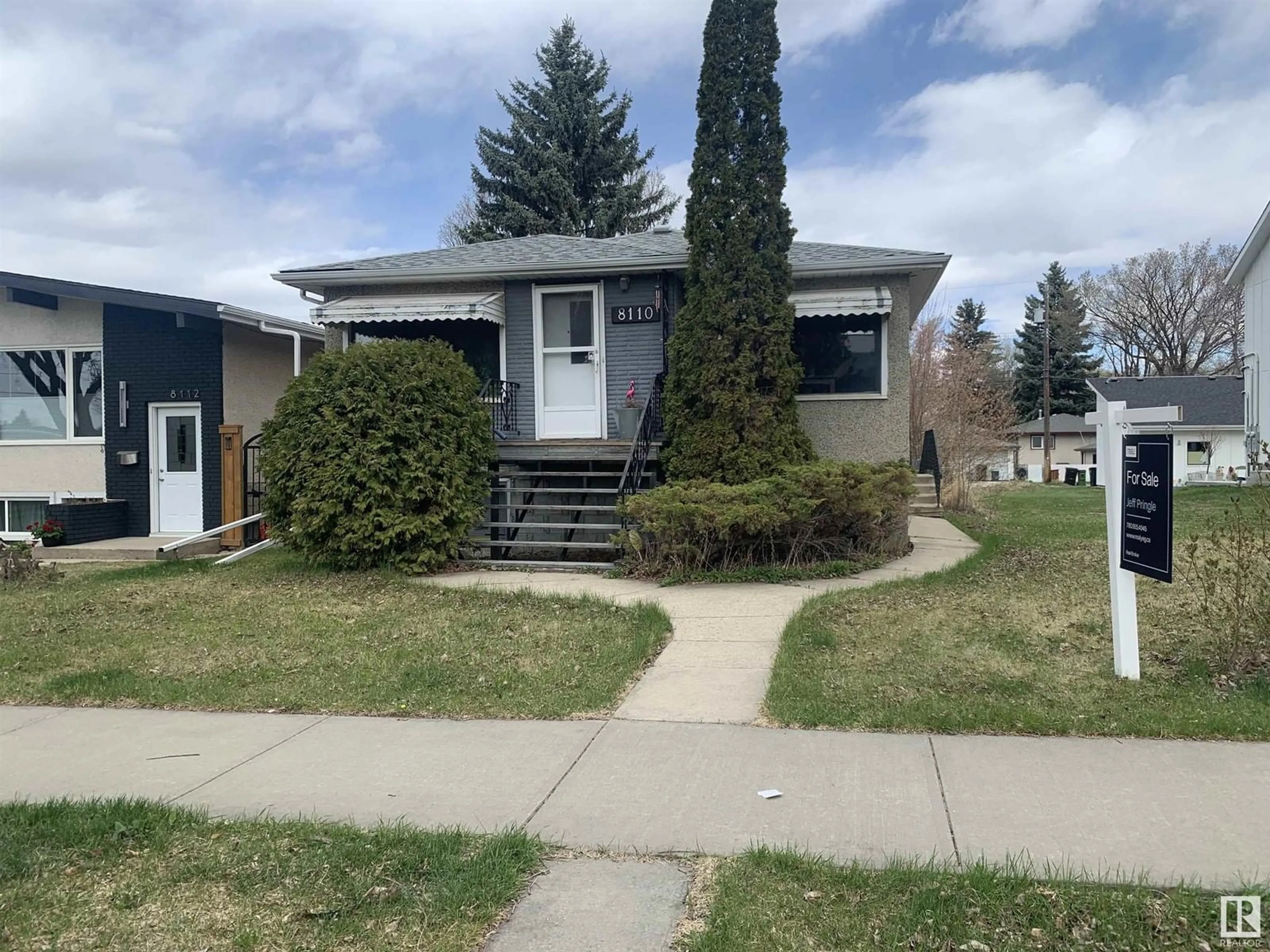 Home with vinyl exterior material, street for 8110 83 AV, Edmonton Alberta T6C1A8