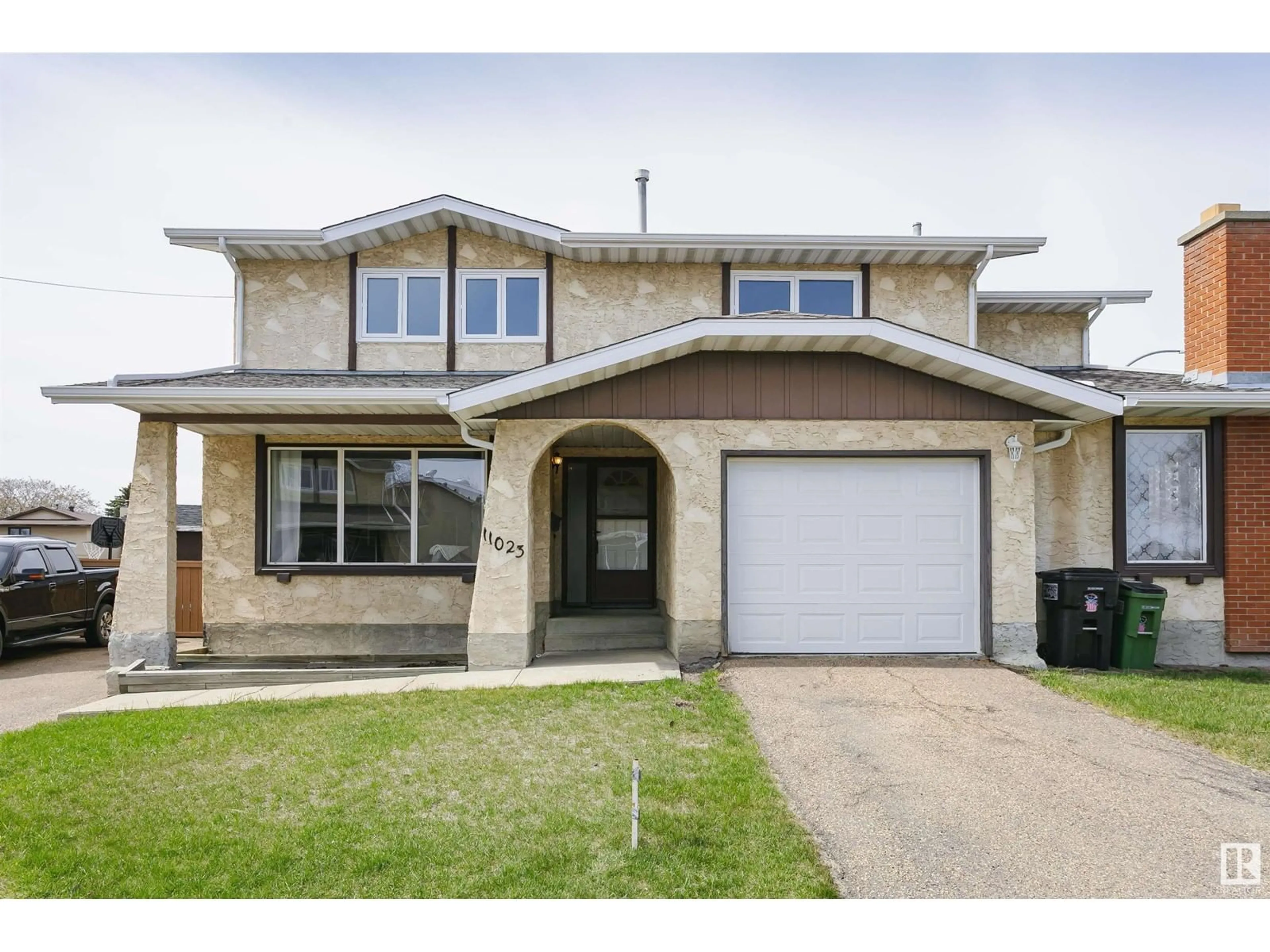 Home with vinyl exterior material, street for 11023 162A AV, Edmonton Alberta T5Z1Z8