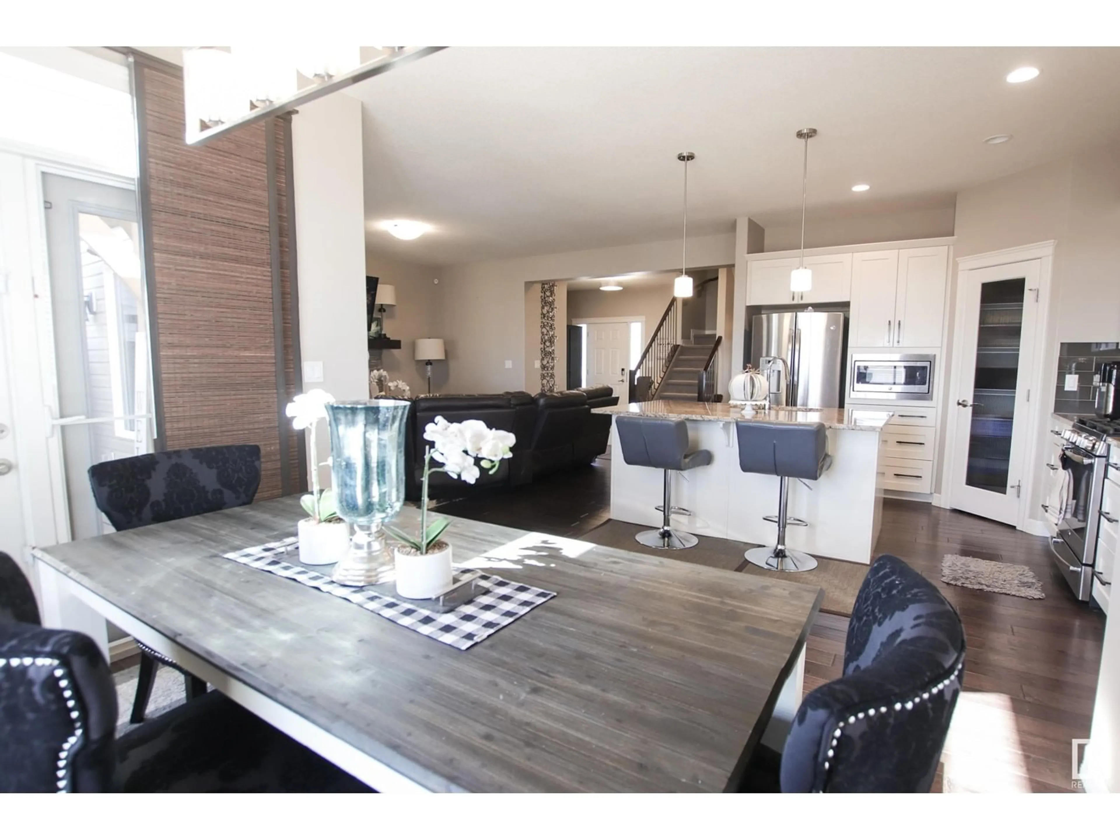 Open concept kitchen, wood/laminate floor for 453 REYNALDS WD, Leduc Alberta T9E1A7