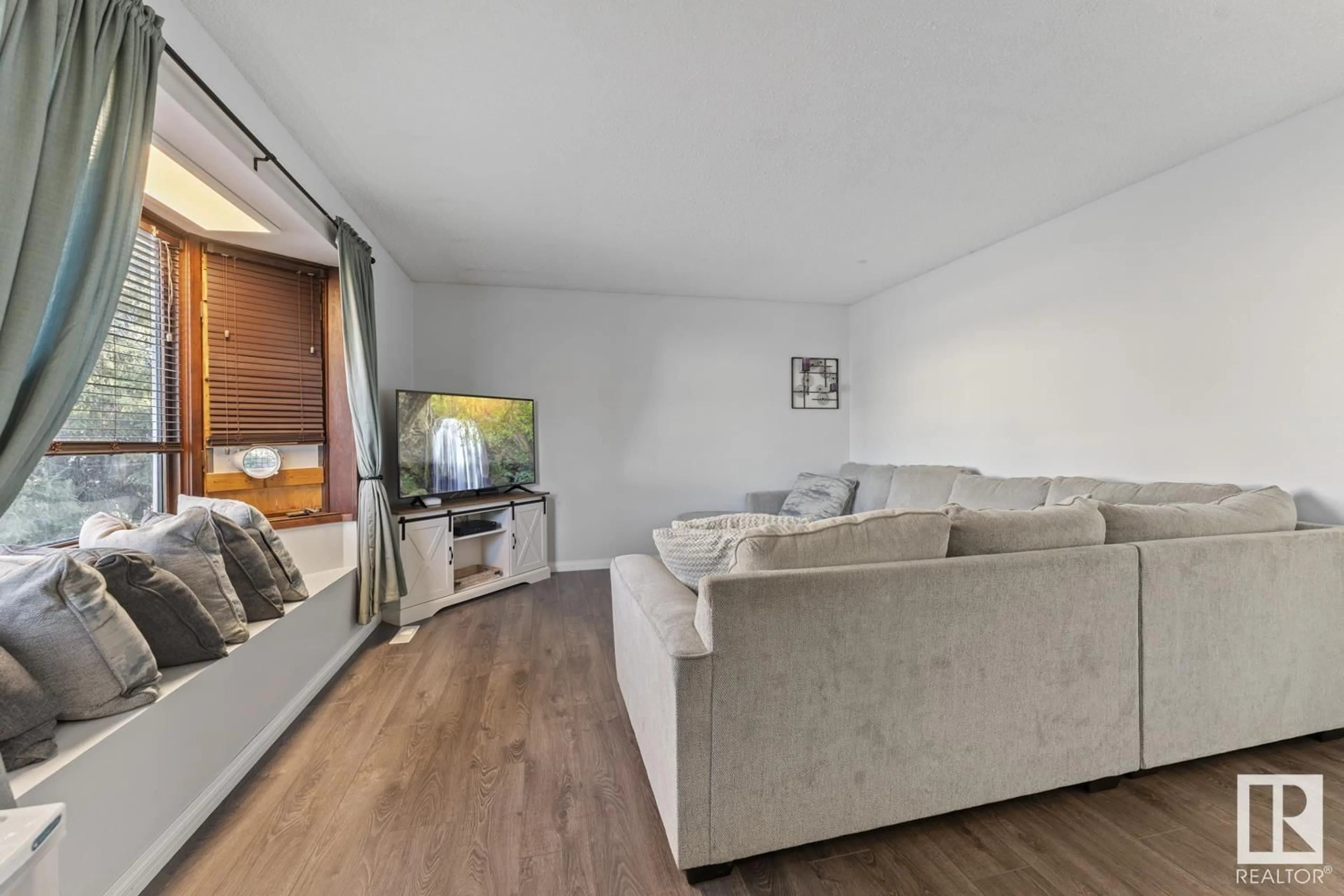 Living room with furniture, wood/laminate floor for 5022 41 ST, Cold Lake Alberta T9M2A6
