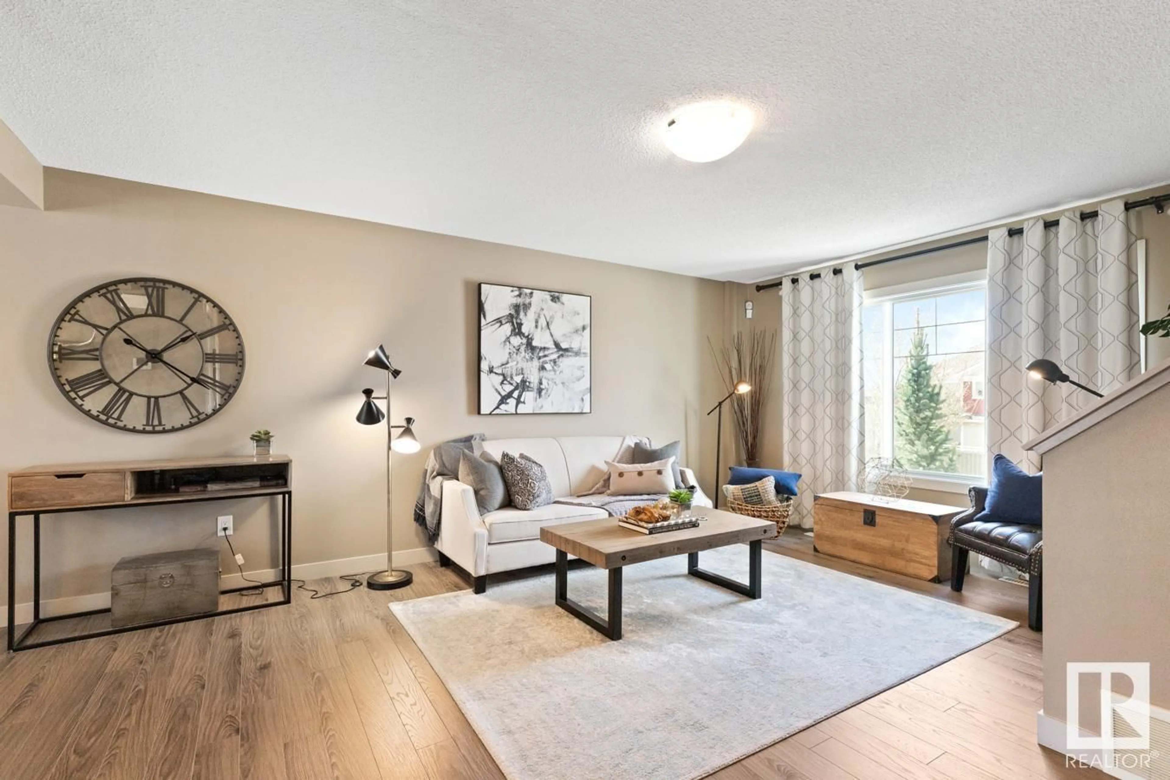Living room with furniture, wood/laminate floor for #9 - 1391 STARLING DR, Edmonton Alberta T5S0L3