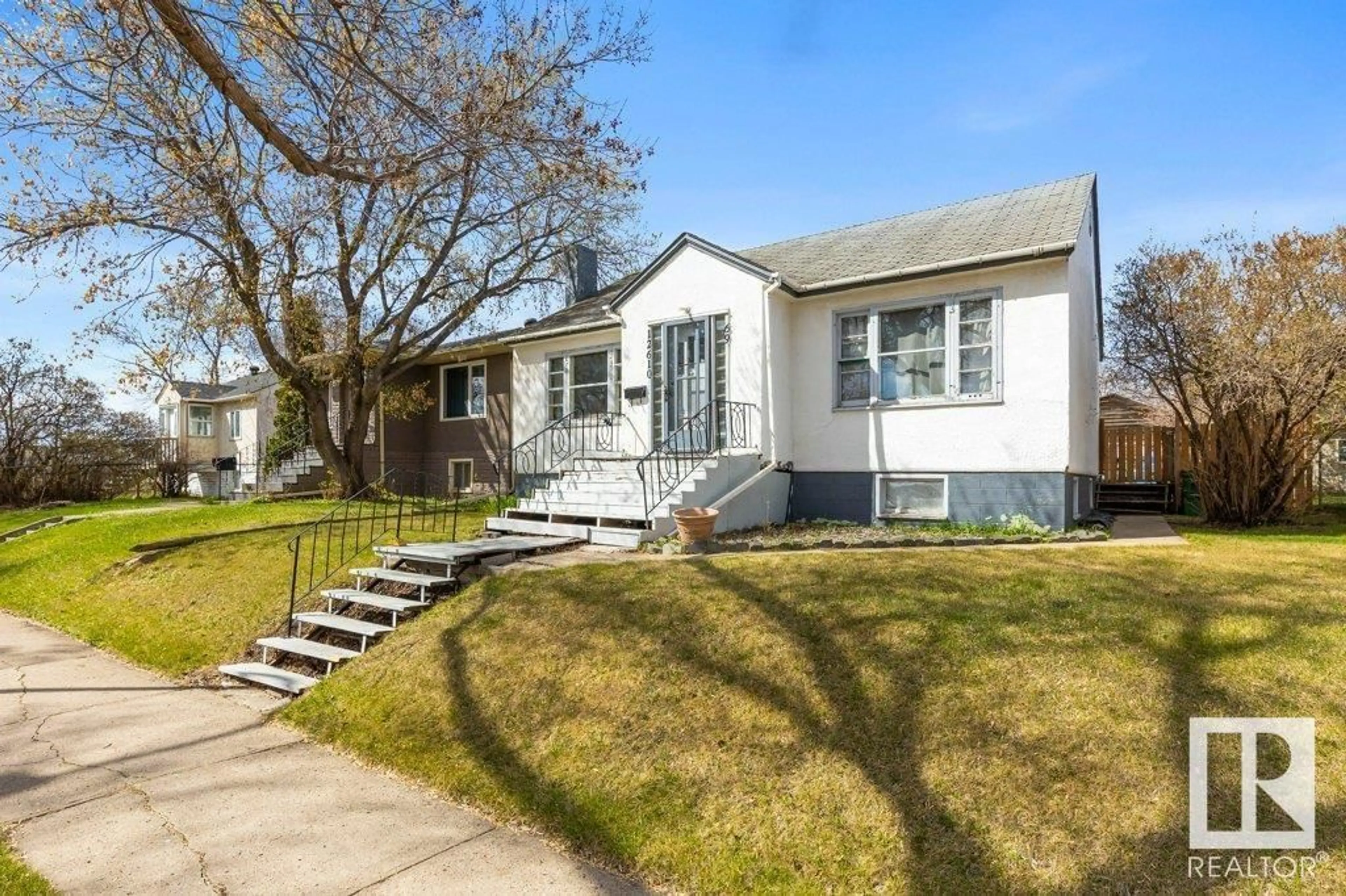 Home with vinyl exterior material, street for 12610 69 ST, Edmonton Alberta T5C0G8