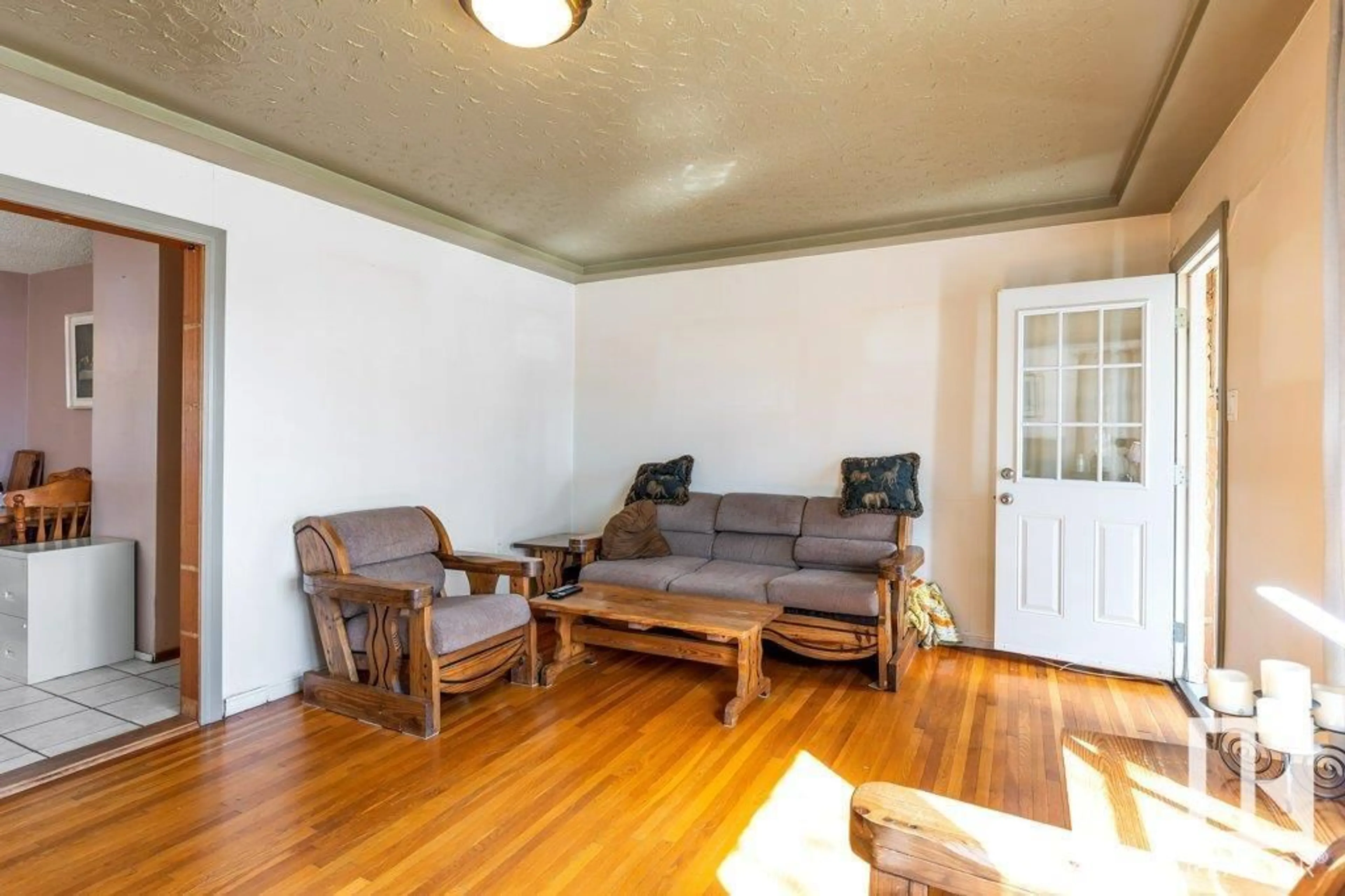 Living room with furniture, wood/laminate floor for 12610 69 ST, Edmonton Alberta T5C0G8