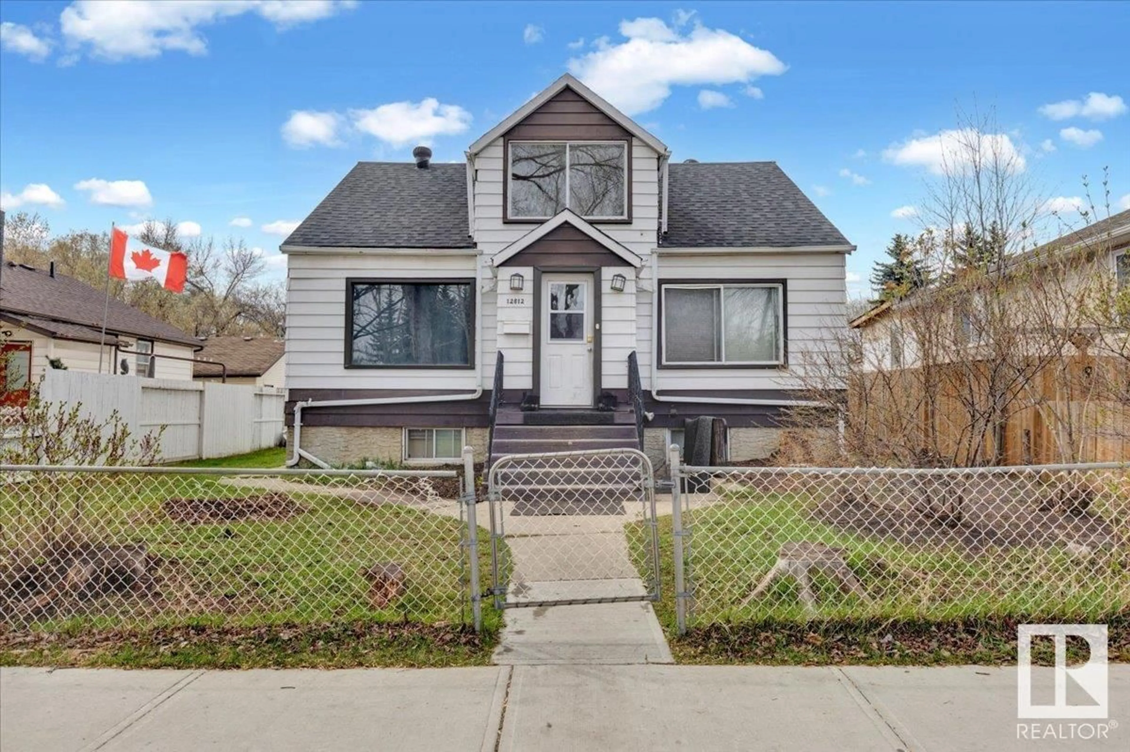 Home with vinyl exterior material, street for NW - 12812 120 ST, Edmonton Alberta T5E5N6