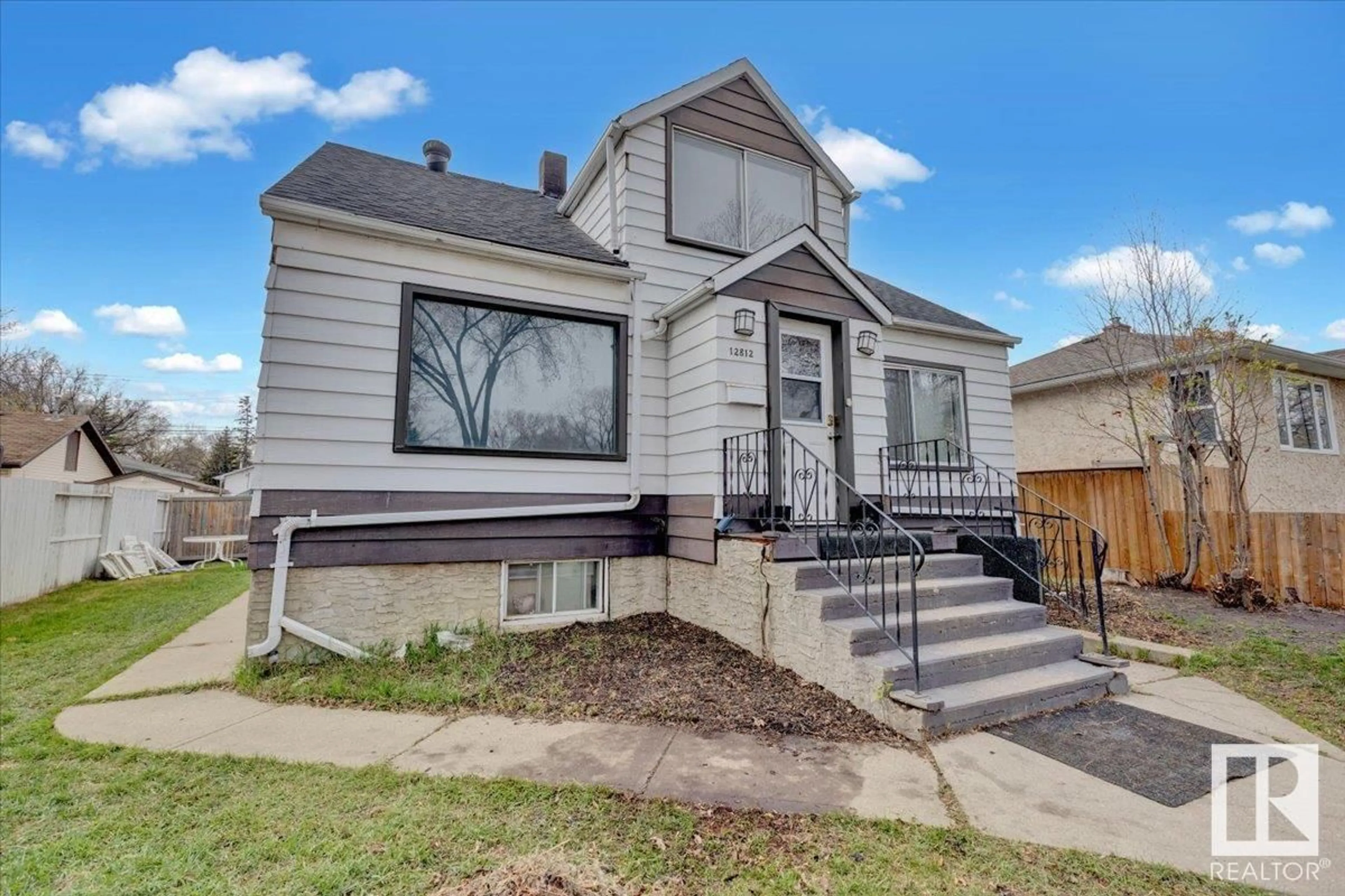 Home with vinyl exterior material, street for NW - 12812 120 ST, Edmonton Alberta T5E5N6