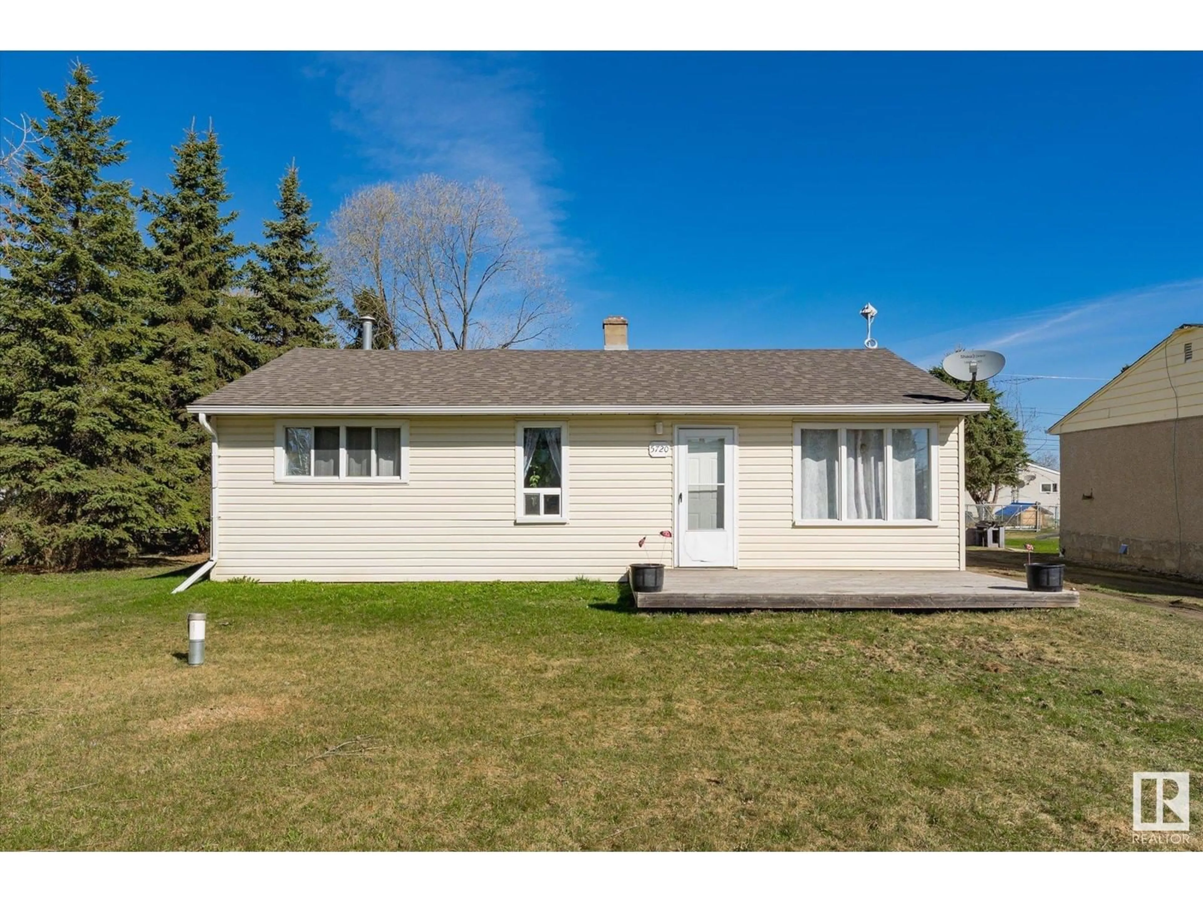 Home with vinyl exterior material, street for 5720 49 AV, Rural Lac Ste. Anne County Alberta T0E0A0
