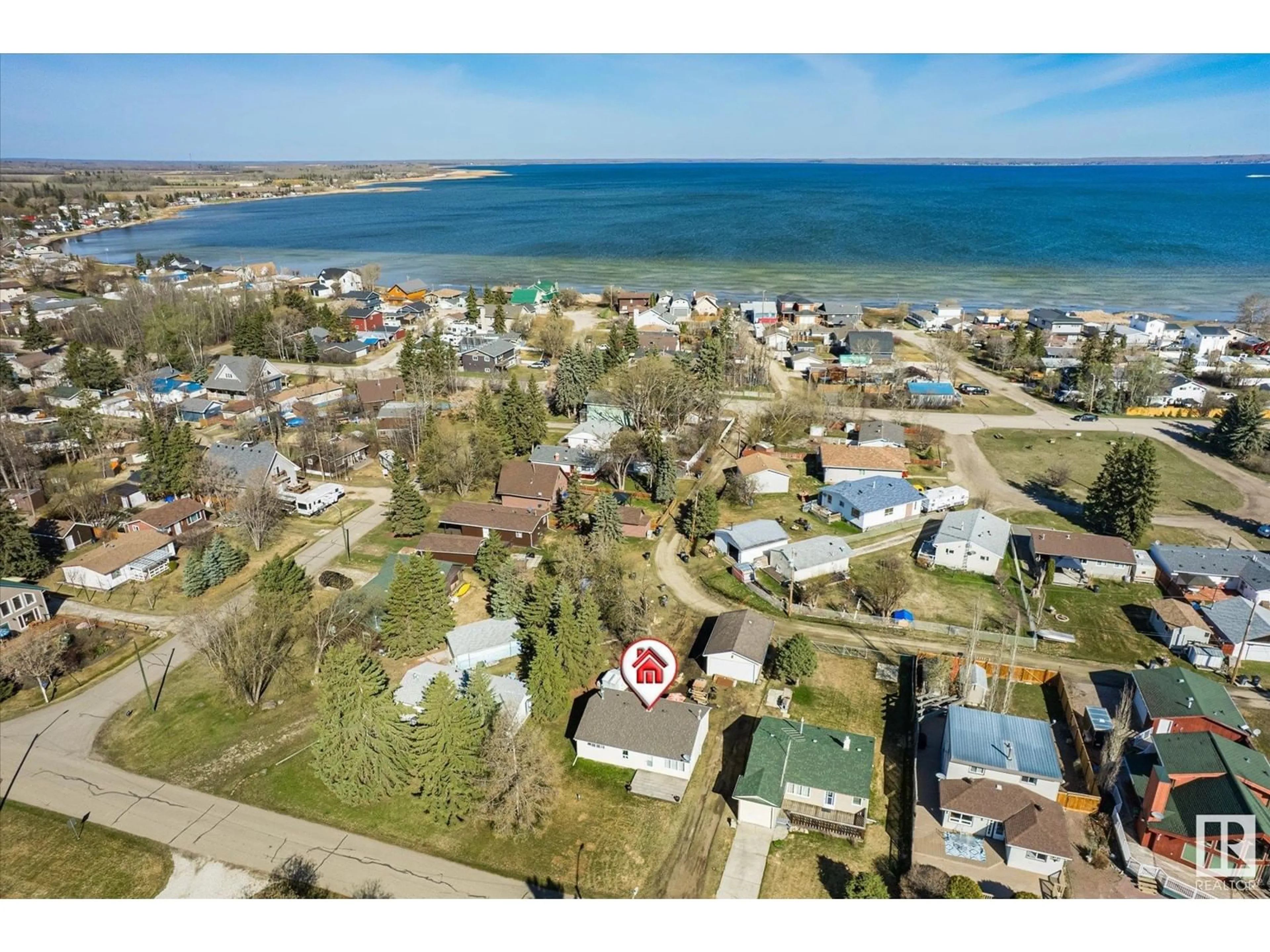 A pic from outside/outdoor area/front of a property/back of a property/a pic from drone, water/lake/river/ocean view for 5720 49 AV, Rural Lac Ste. Anne County Alberta T0E0A0