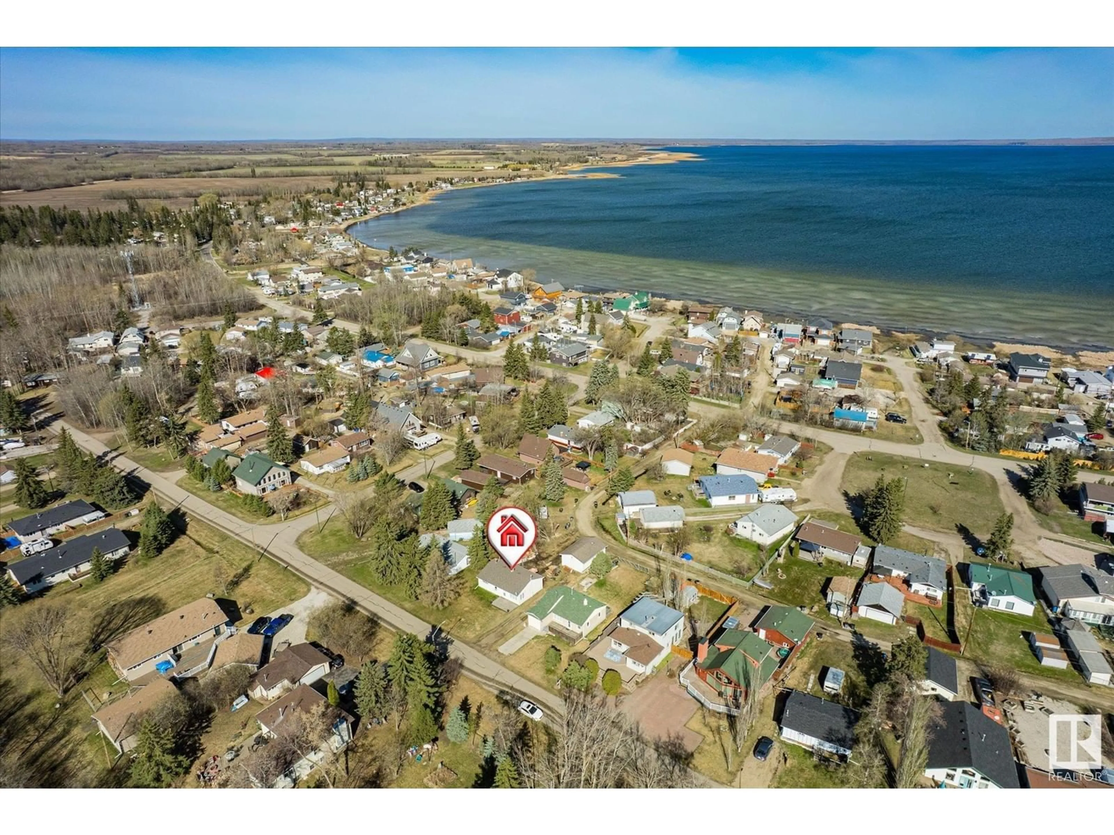 A pic from outside/outdoor area/front of a property/back of a property/a pic from drone, water/lake/river/ocean view for 5720 49 AV, Rural Lac Ste. Anne County Alberta T0E0A0