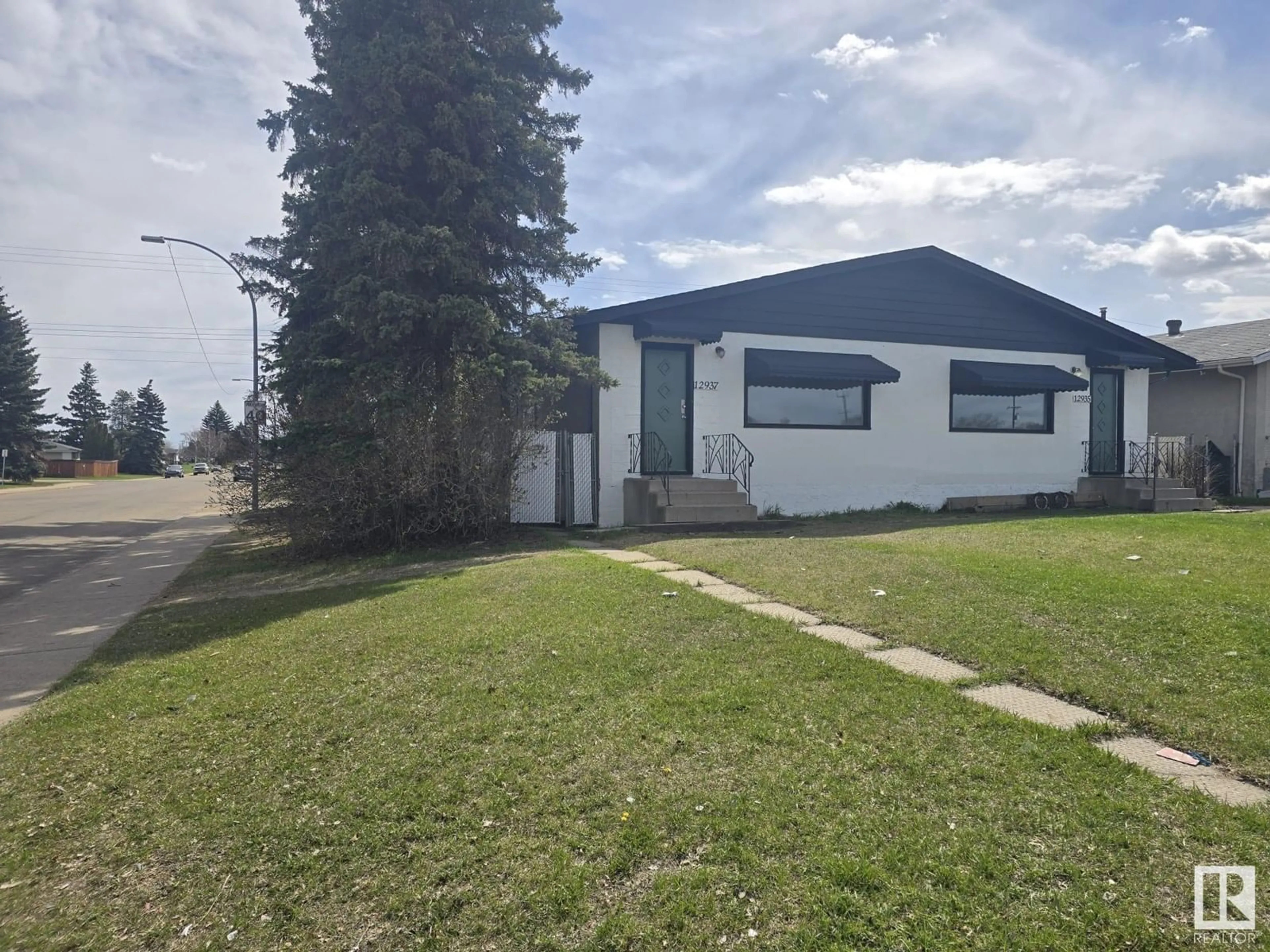 A pic from outside/outdoor area/front of a property/back of a property/a pic from drone, street for 12935 82 ST, Edmonton Alberta T5E2T3