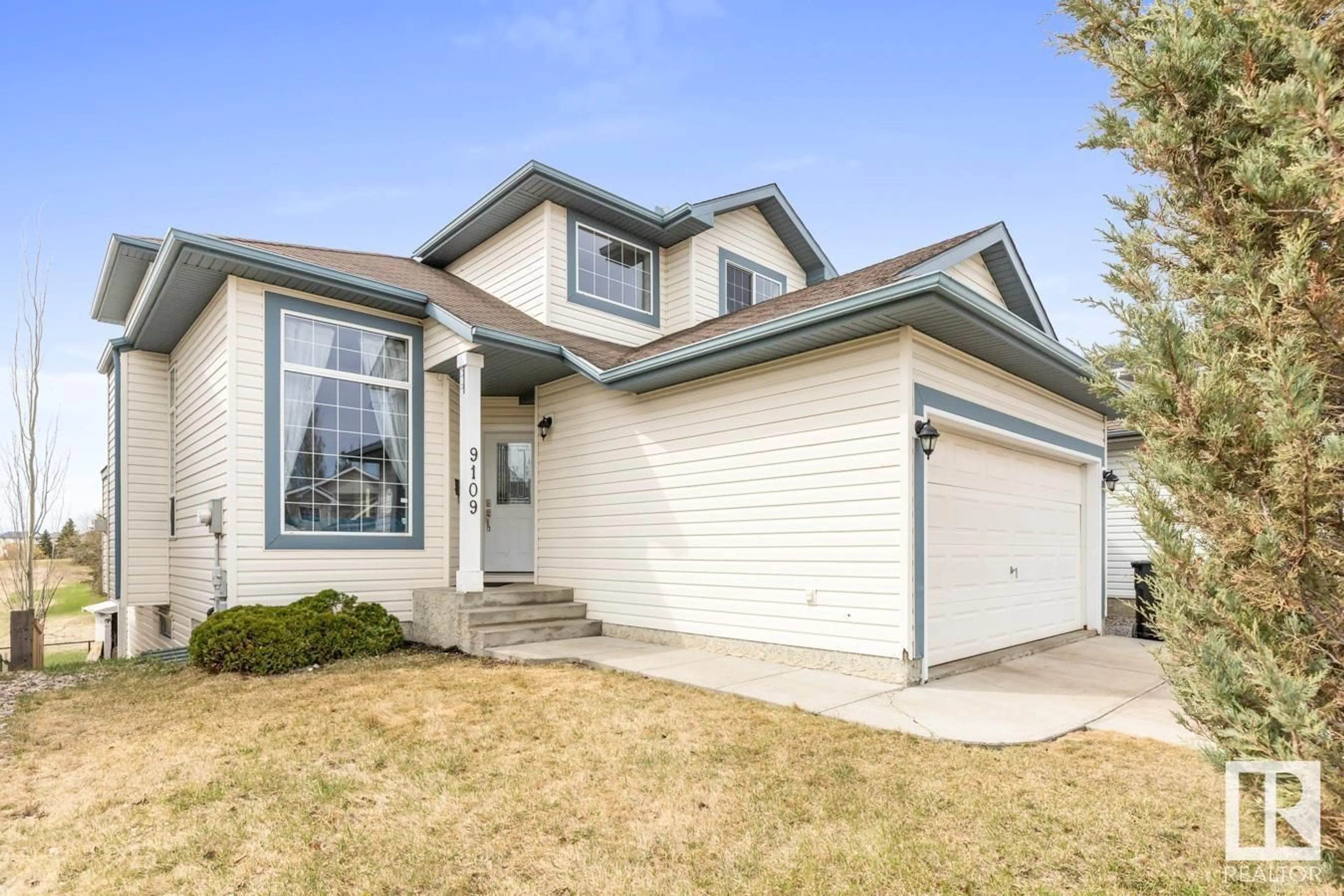 Home with vinyl exterior material, street for 9109 164 AV, Edmonton Alberta T5Z3H7