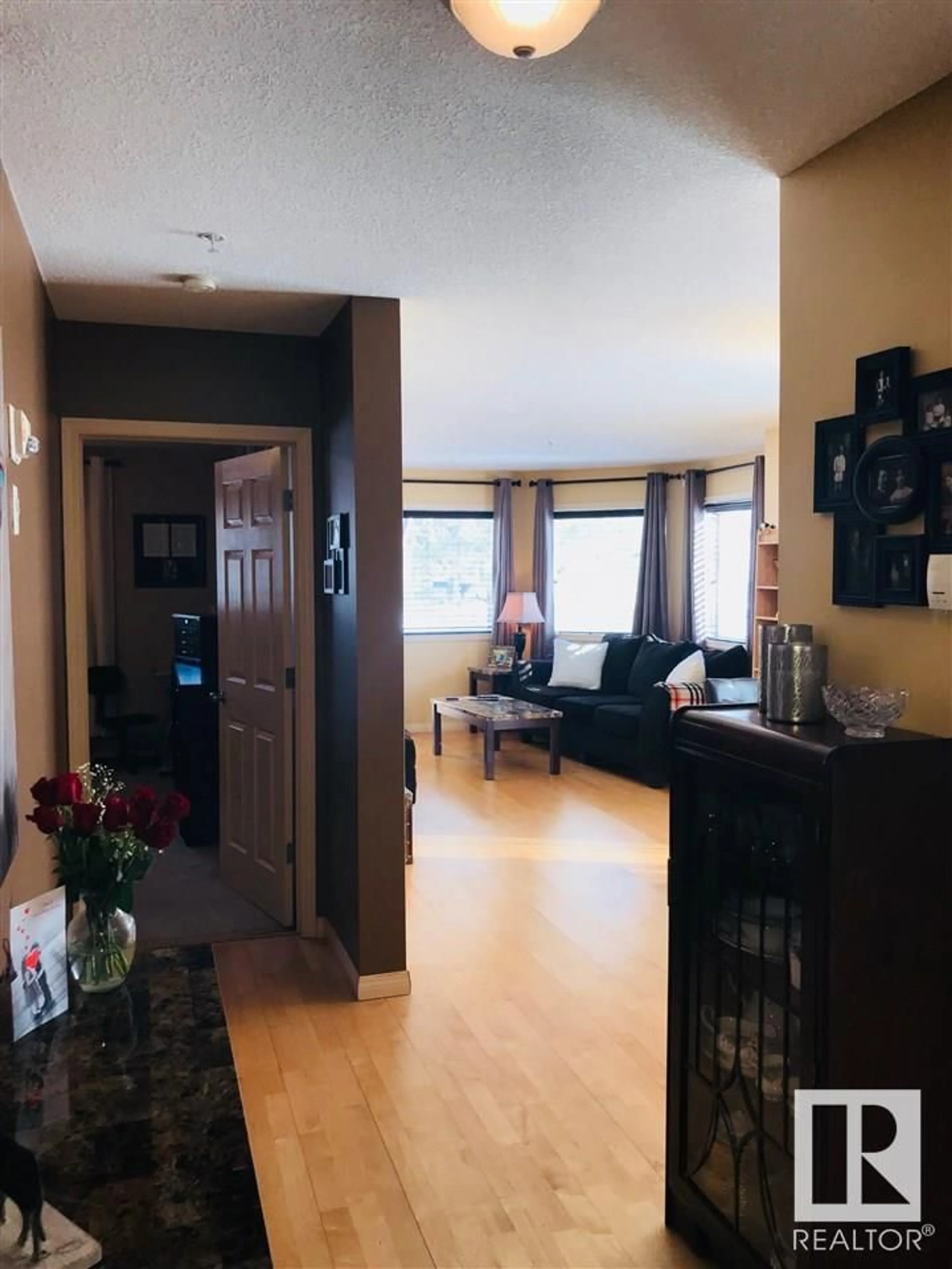 Living room with furniture, wood/laminate floor for #101 - 11408 108 AV, Edmonton Alberta T5H4R5