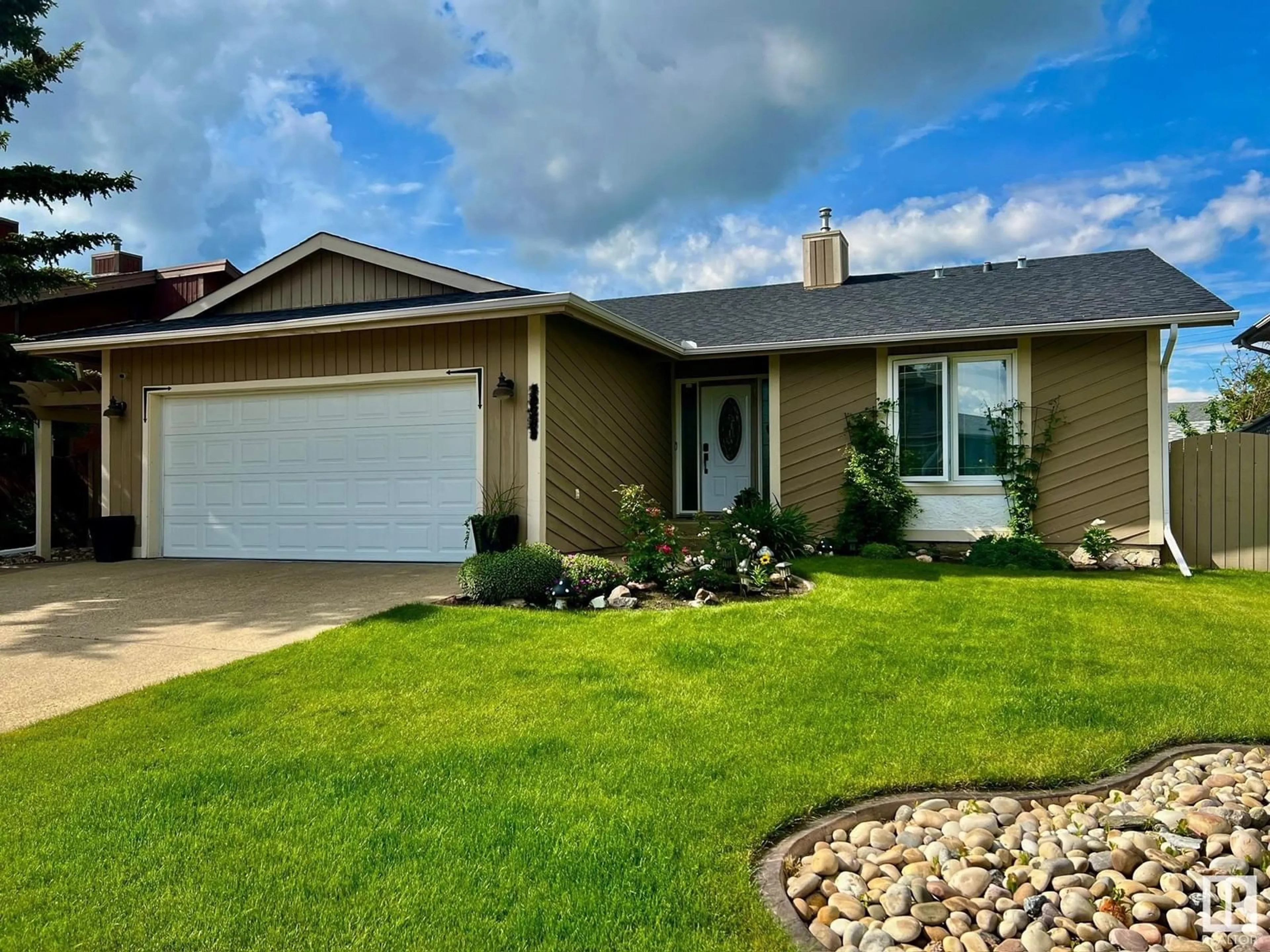 Home with vinyl exterior material, street for 12208 151 AV, Edmonton Alberta T5X4A6