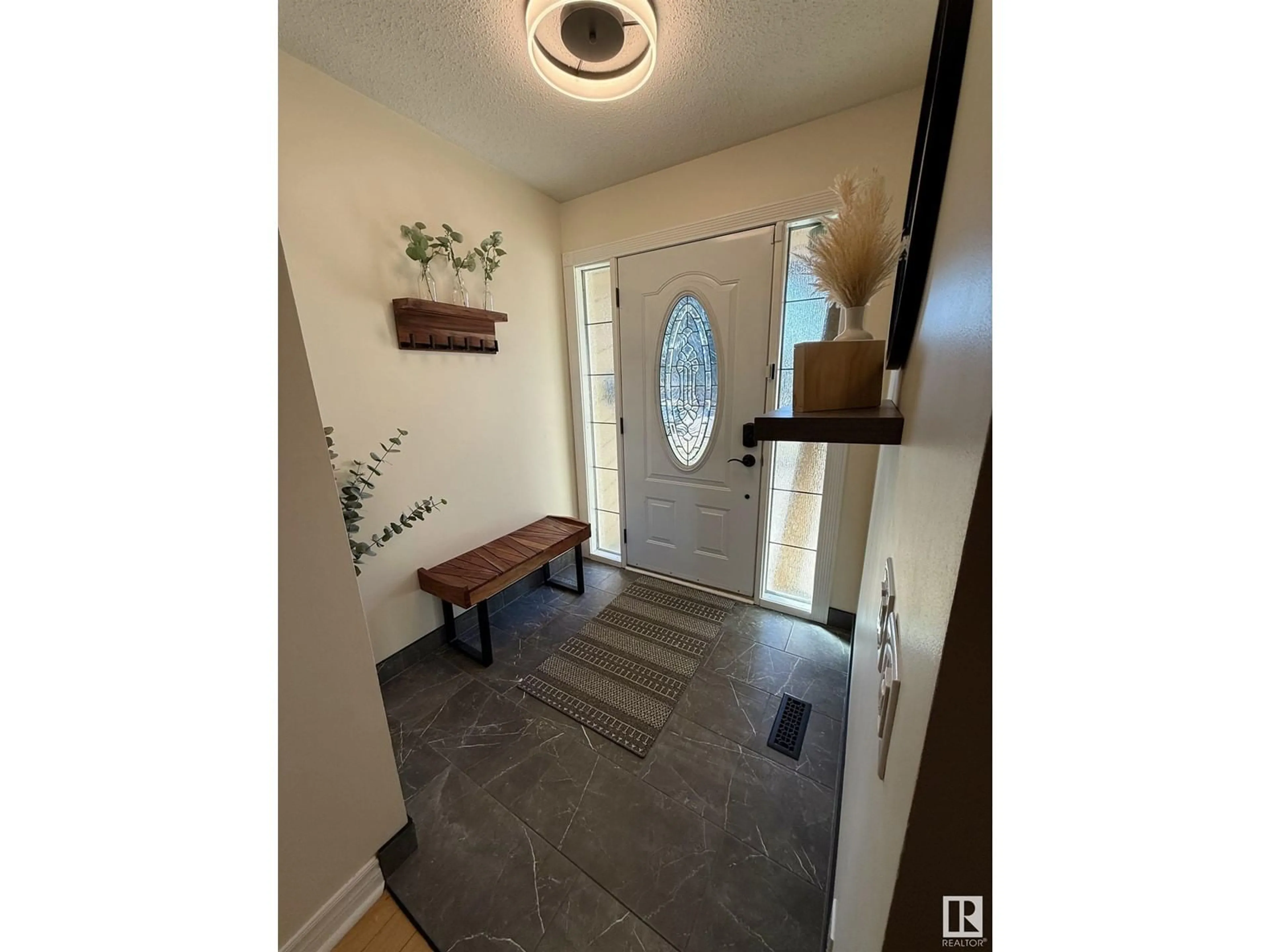 Indoor entryway for 12208 151 AV, Edmonton Alberta T5X4A6