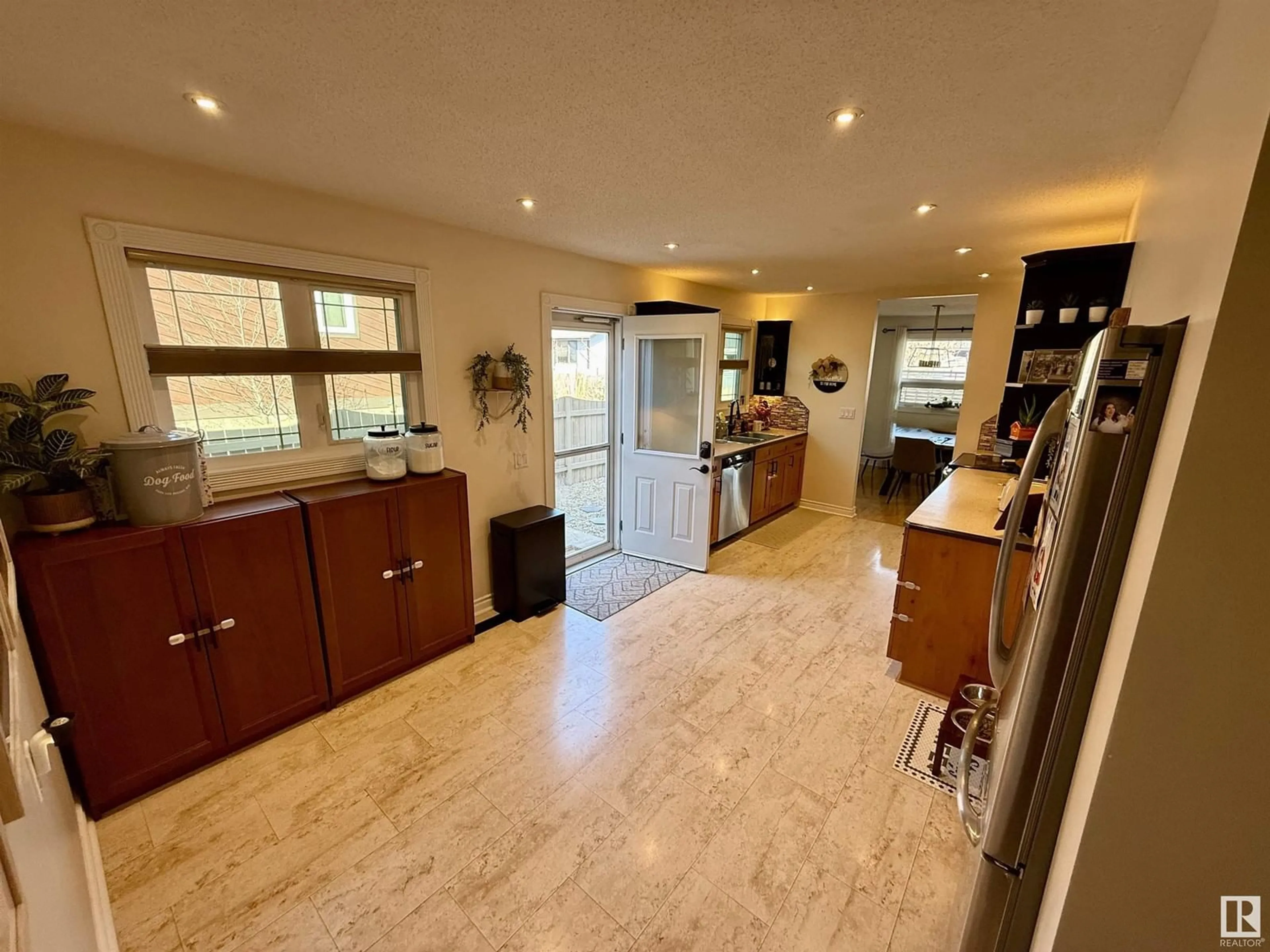 Open concept kitchen, ceramic/tile floor for 12208 151 AV, Edmonton Alberta T5X4A6