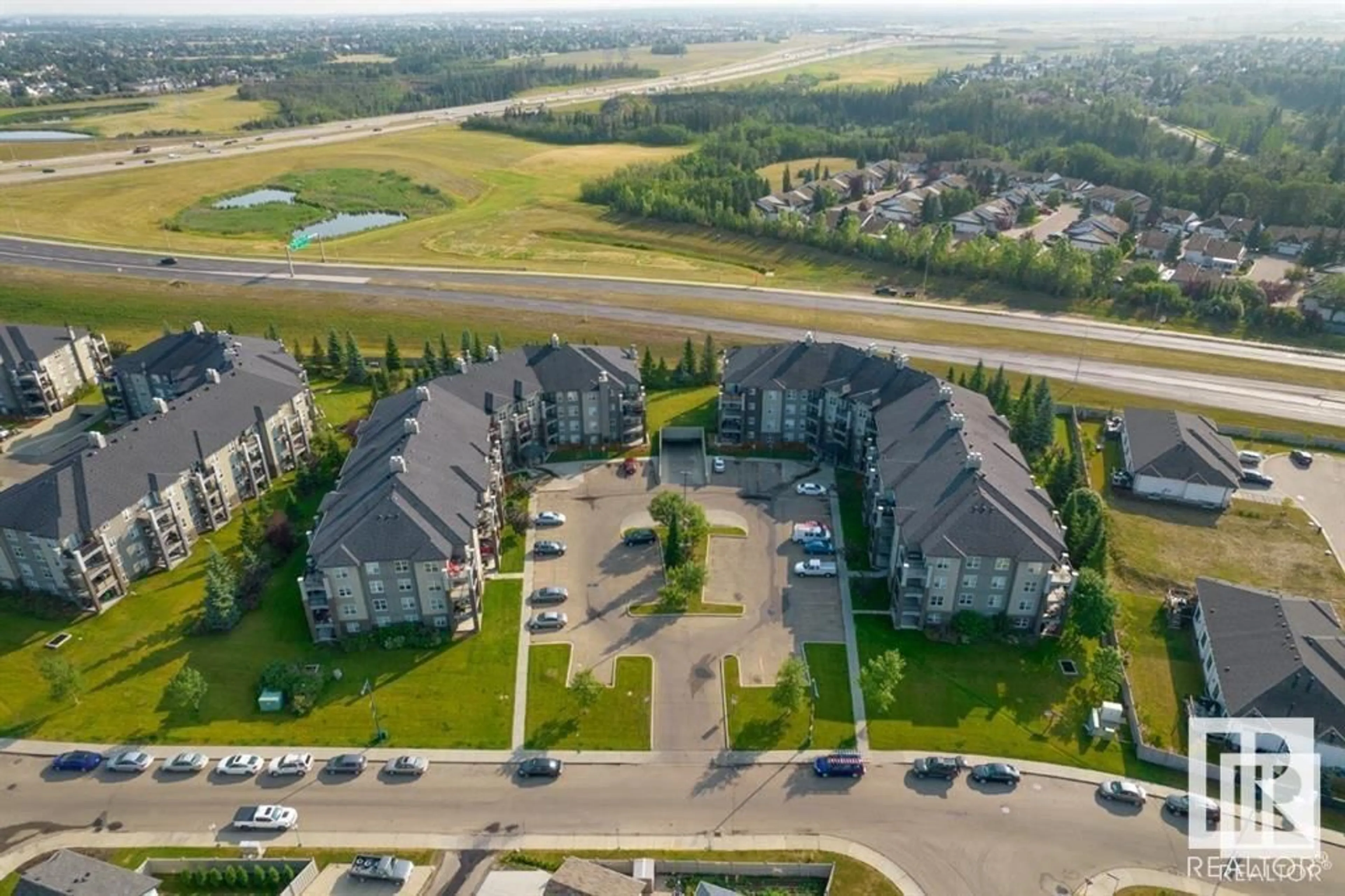 A pic from outside/outdoor area/front of a property/back of a property/a pic from drone, unknown for #101 - 630 MCALLISTER LO, Edmonton Alberta T6W1N3