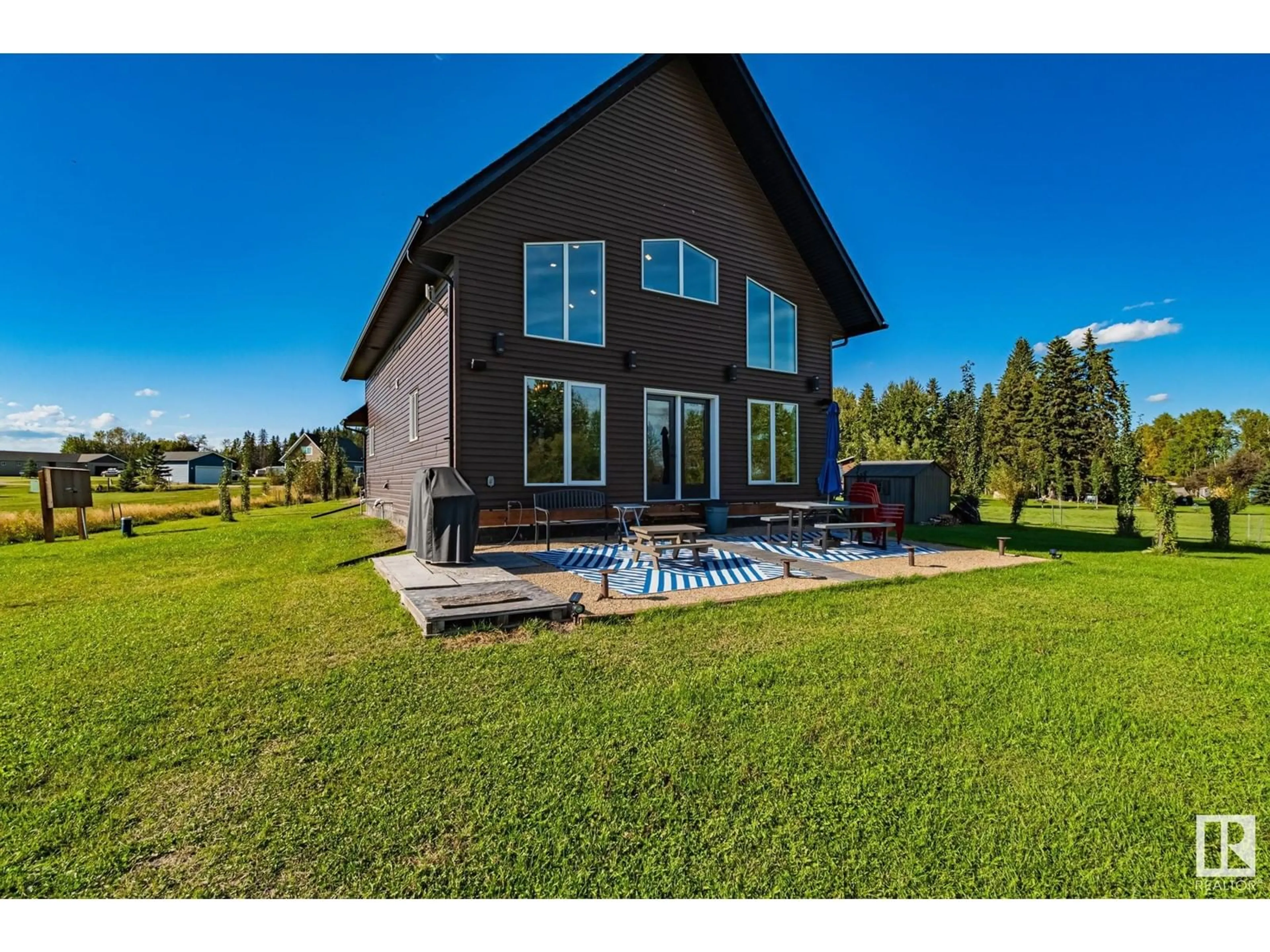 A pic from outside/outdoor area/front of a property/back of a property/a pic from drone, water/lake/river/ocean view for 209 - 62002 TWP RD 462 A, Rural Wetaskiwin County Alberta T0C0T0