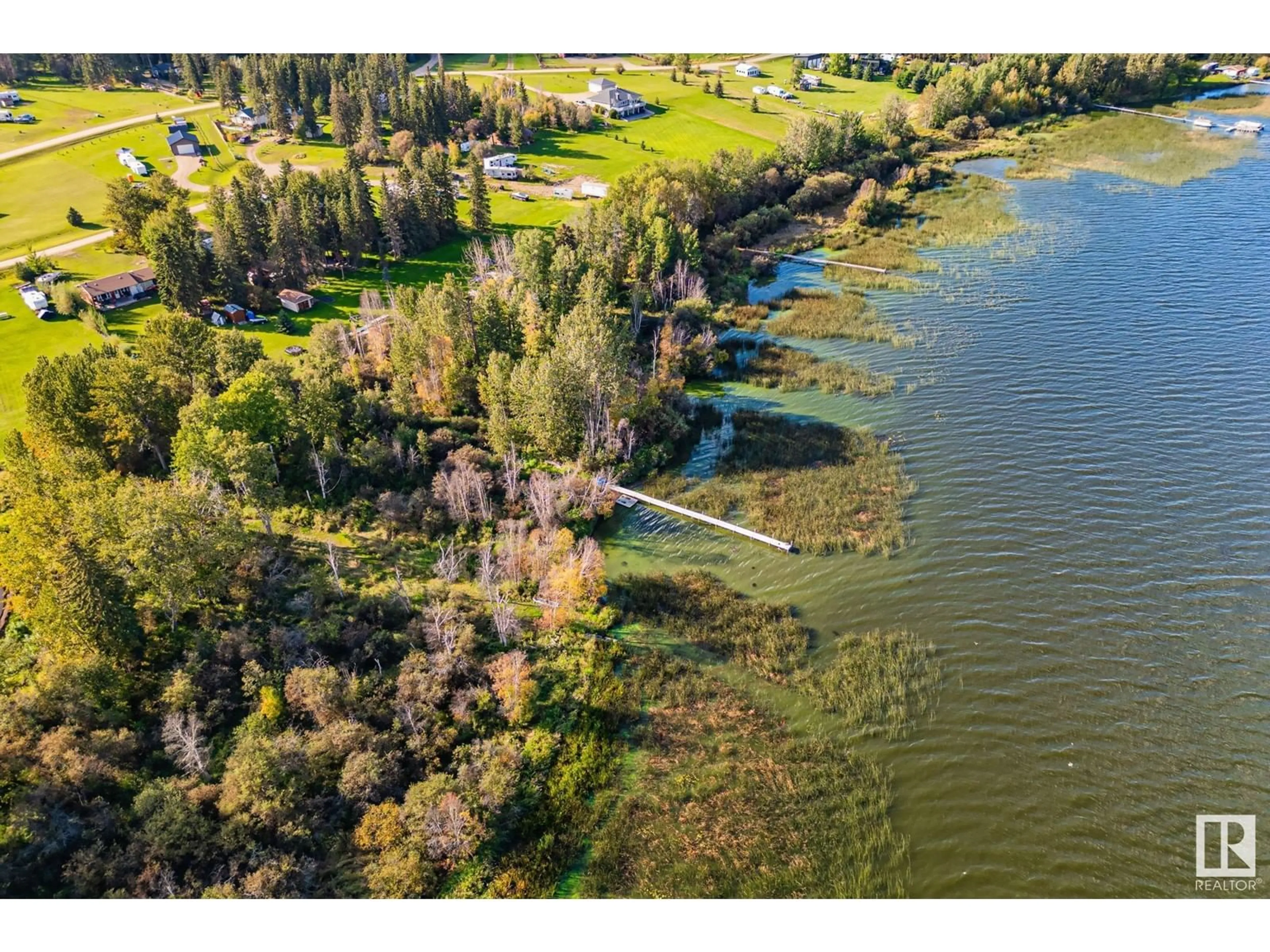 A pic from outside/outdoor area/front of a property/back of a property/a pic from drone, water/lake/river/ocean view for 209 - 62002 TWP RD 462 A, Rural Wetaskiwin County Alberta T0C0T0