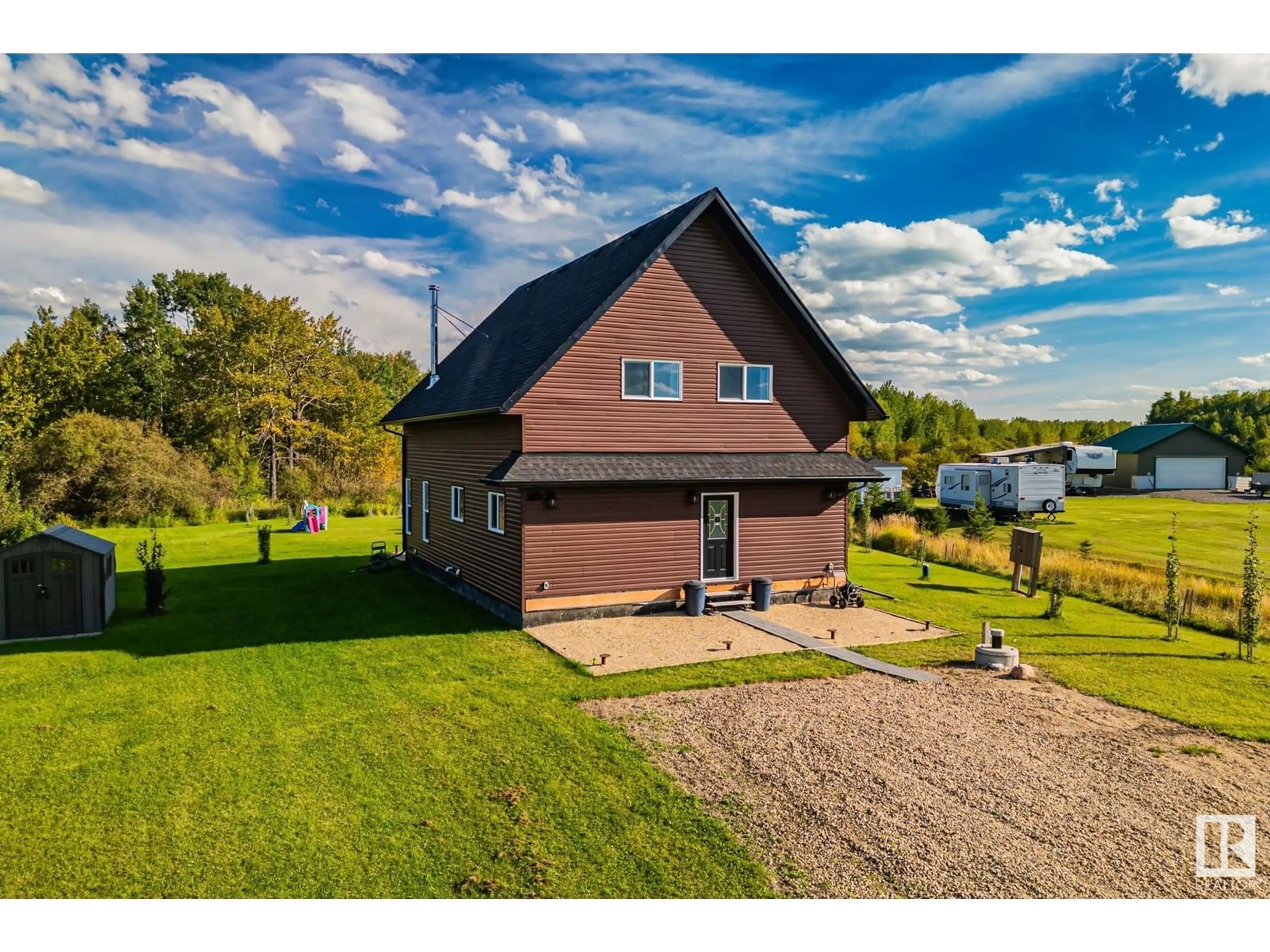 A pic from outside/outdoor area/front of a property/back of a property/a pic from drone, water/lake/river/ocean view for 209 - 62002 TWP RD 462 A, Rural Wetaskiwin County Alberta T0C0T0