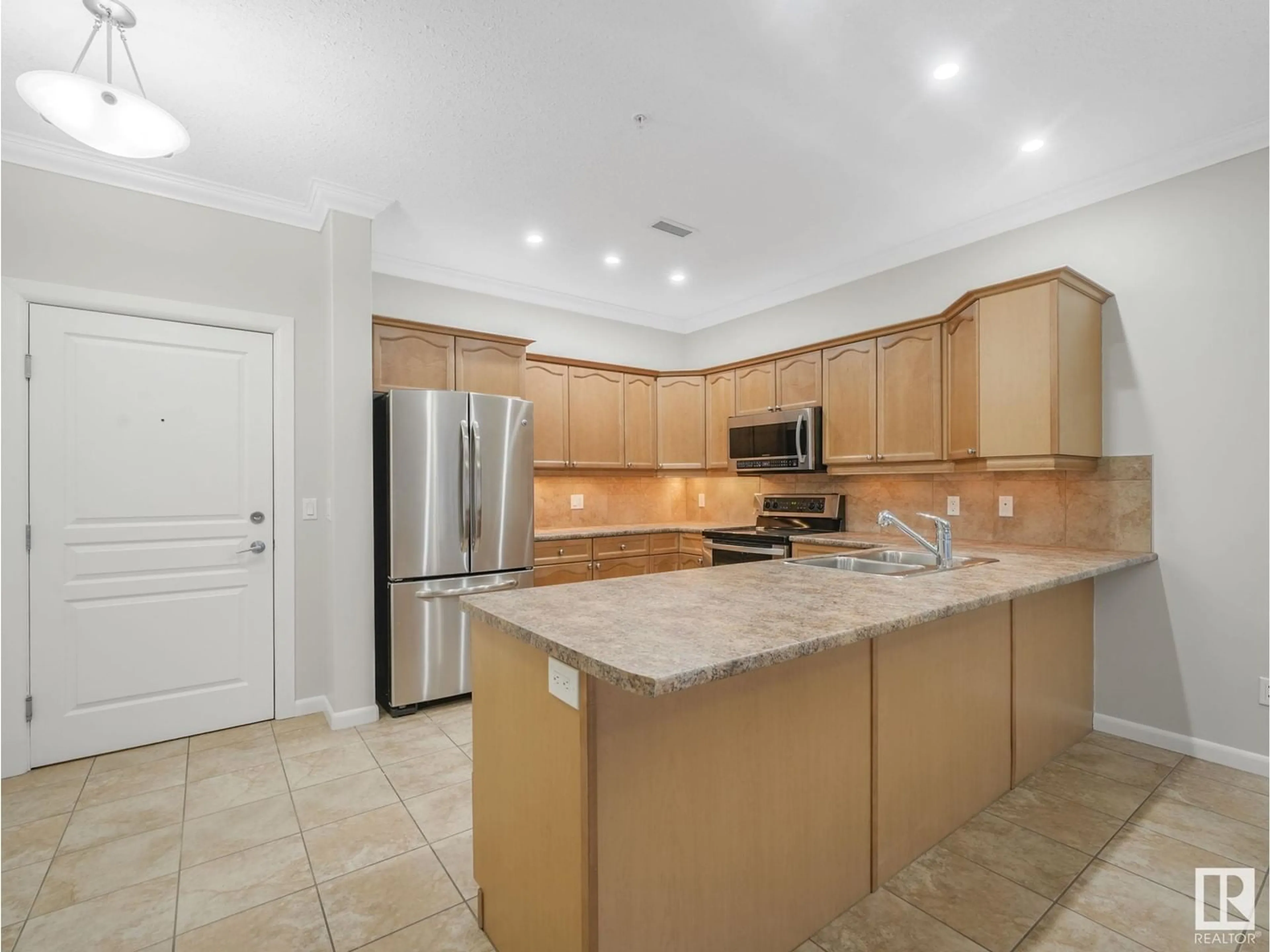 Open concept kitchen, ceramic/tile floor for 160 - 116 MAGRATH RD, Edmonton Alberta T6R3T7