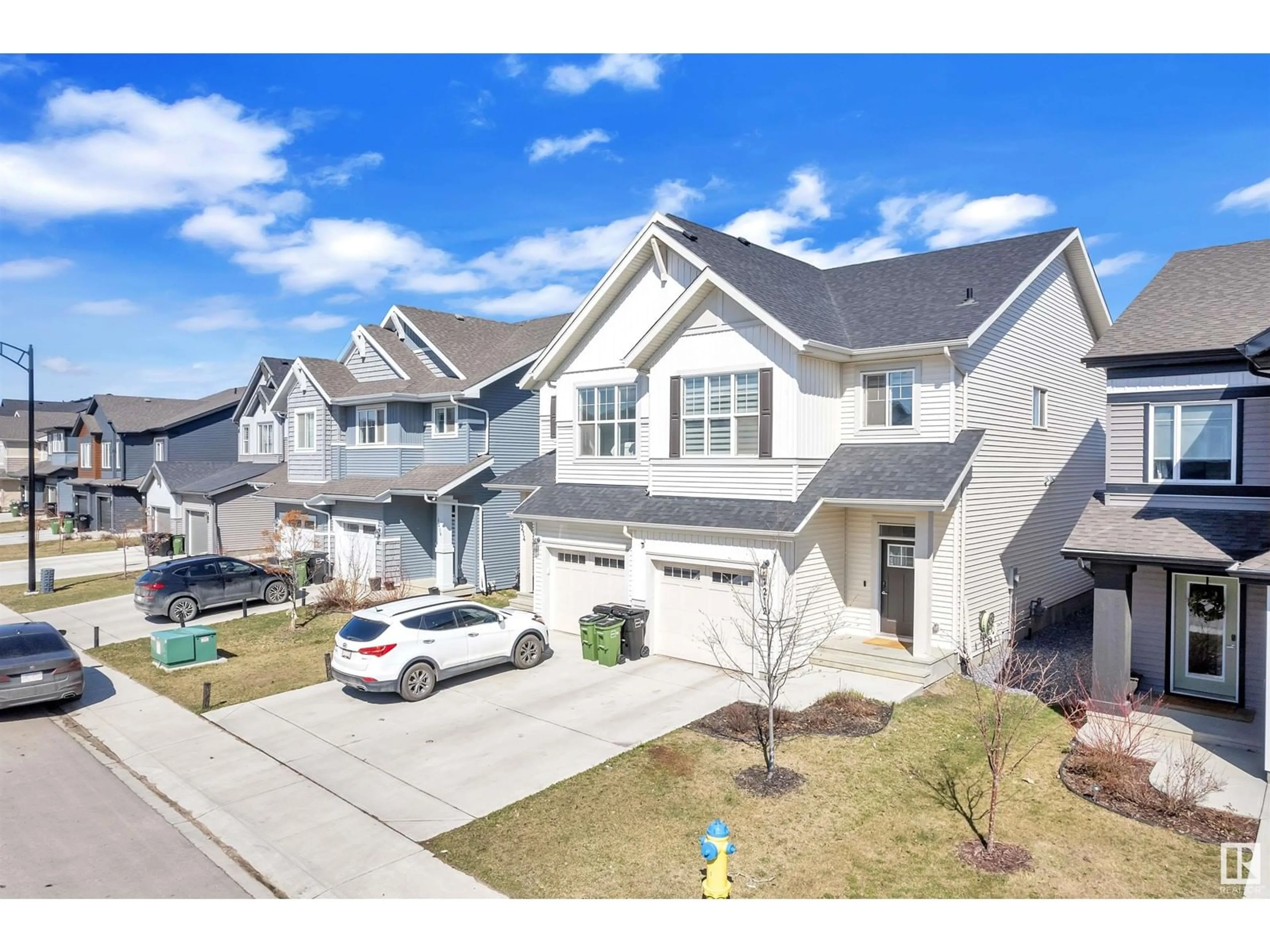 A pic from outside/outdoor area/front of a property/back of a property/a pic from drone, street for SW SW - 1212 PODERSKY WD, Edmonton Alberta T6W4W3