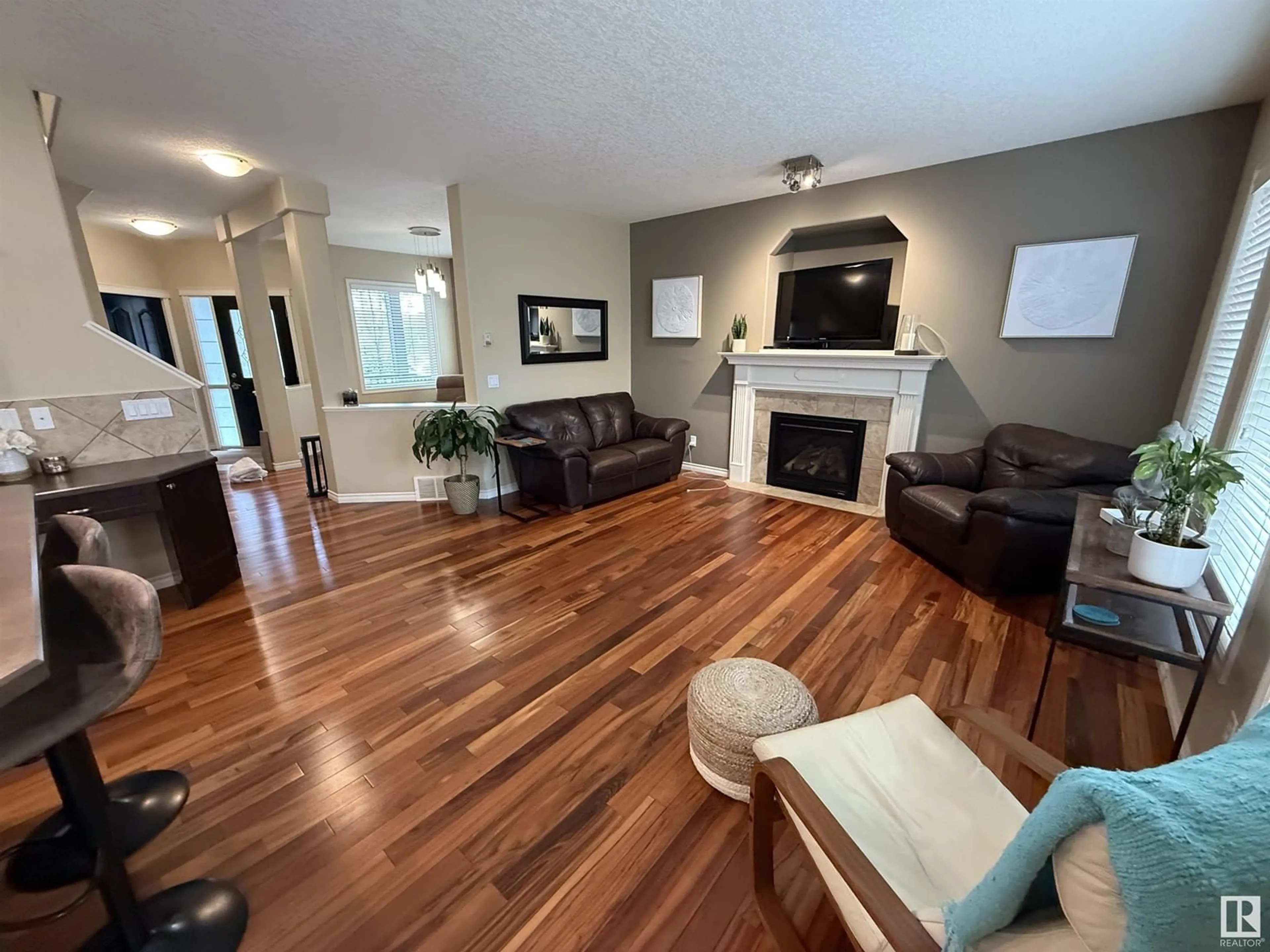 Living room with furniture, wood/laminate floor for 8645 SLOANE CO NW, Edmonton Alberta T6K0K9