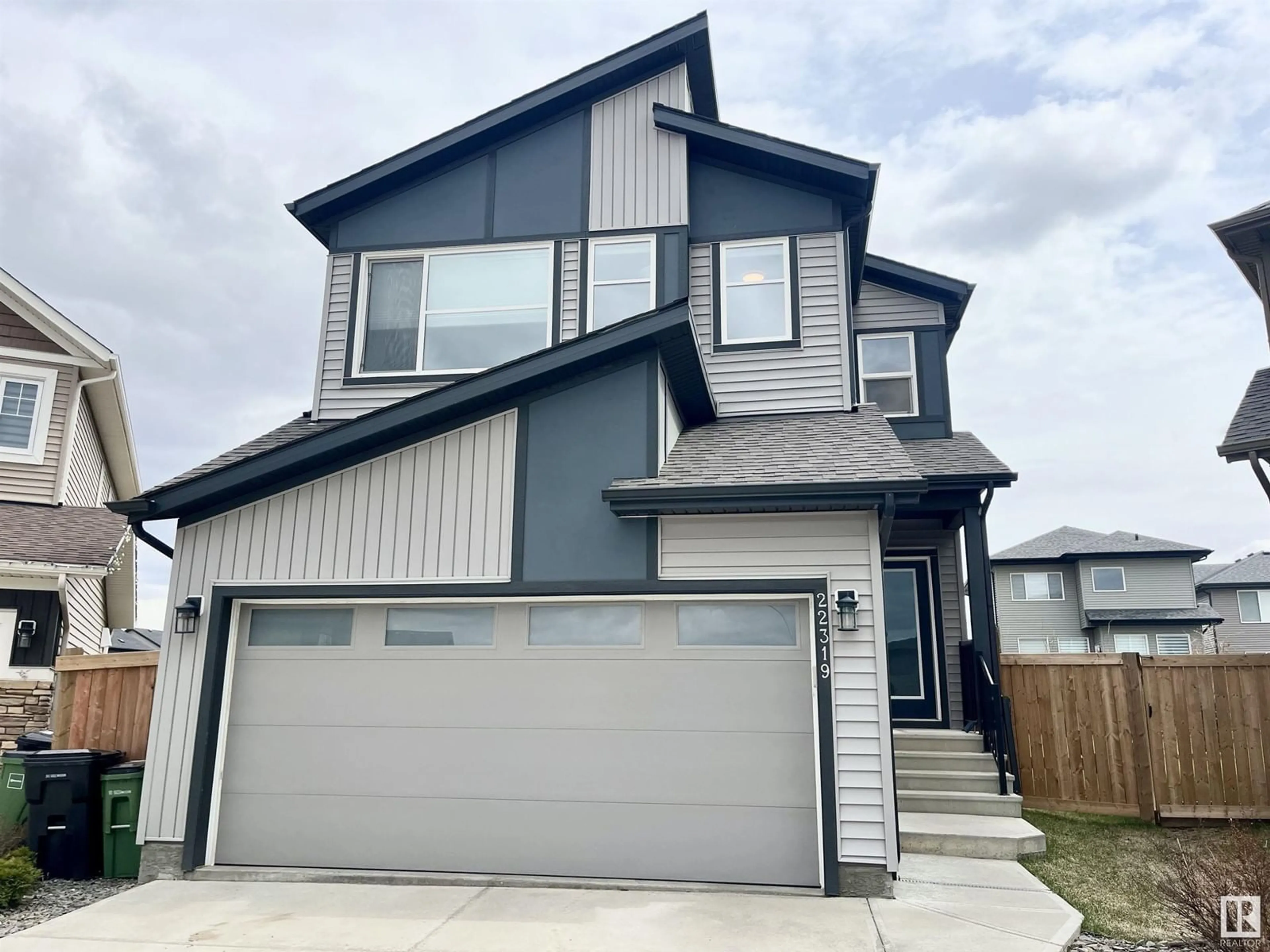 Home with vinyl exterior material, street for 22319 94 AV, Edmonton Alberta T5T7J9