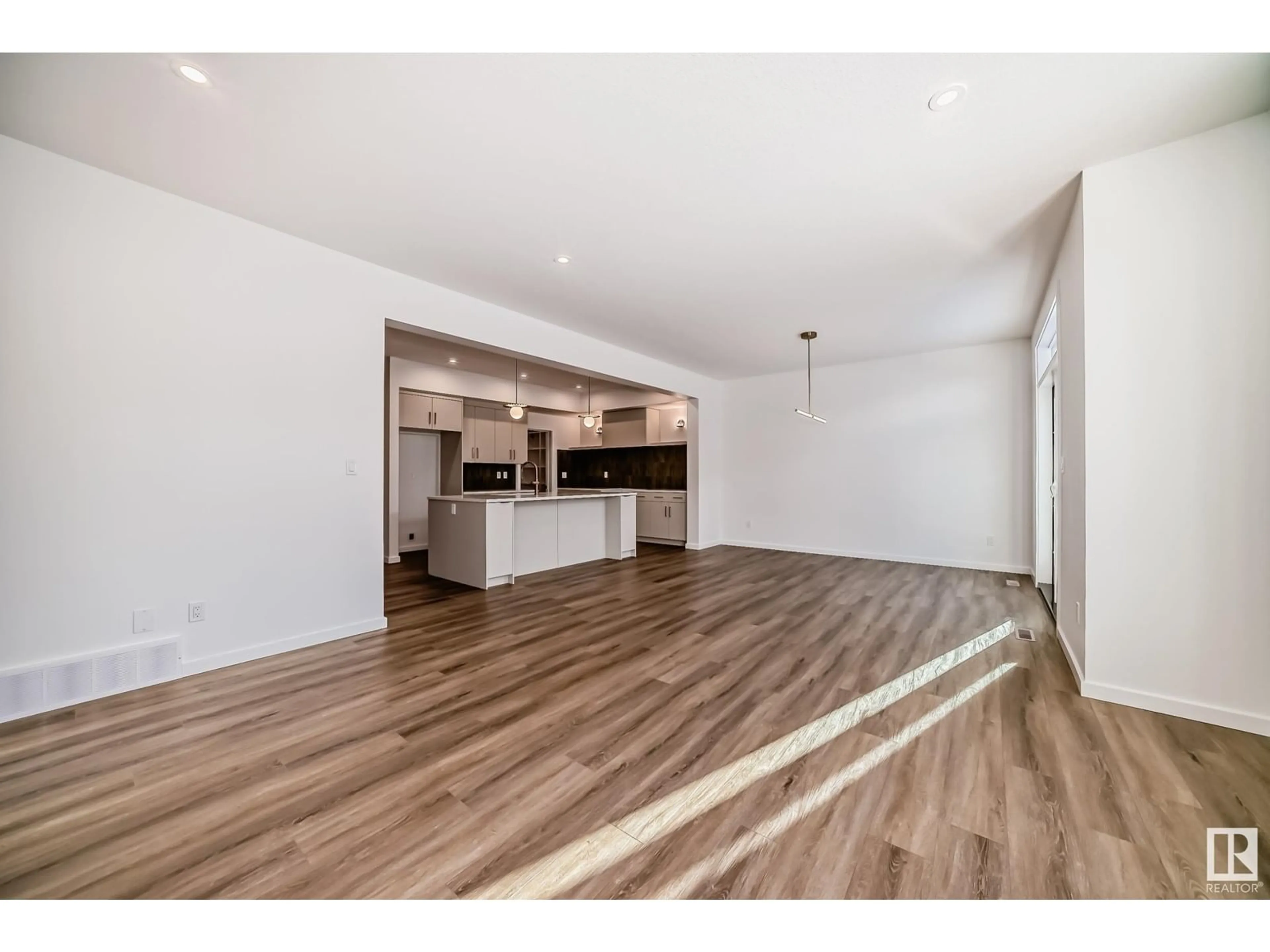 Open concept kitchen, wood/laminate floor for 1362 AINSLIE WD, Edmonton Alberta T6W2L9