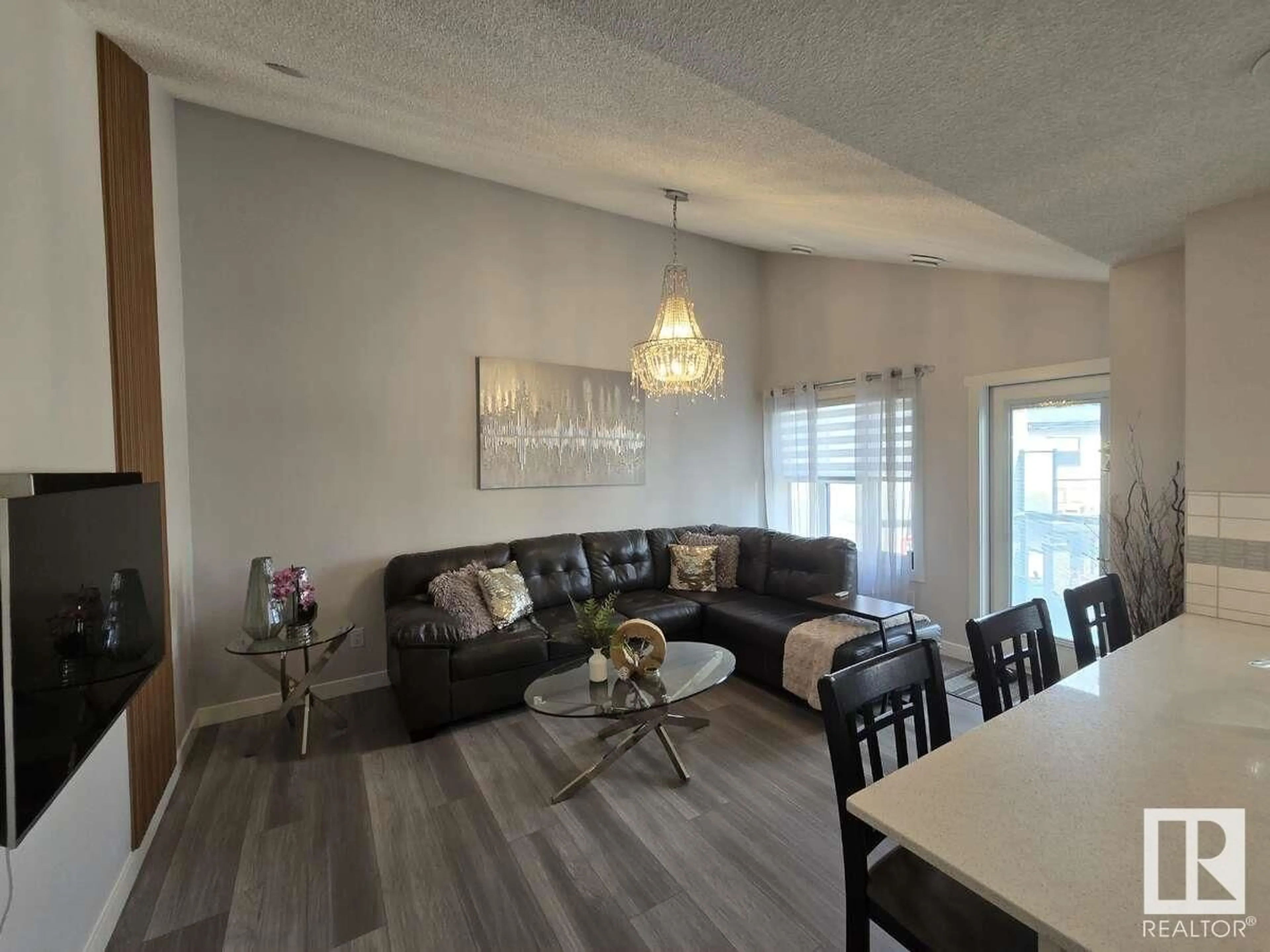 Living room with furniture, wood/laminate floor for #101 - 1203 163 ST, Edmonton Alberta T6W3X1