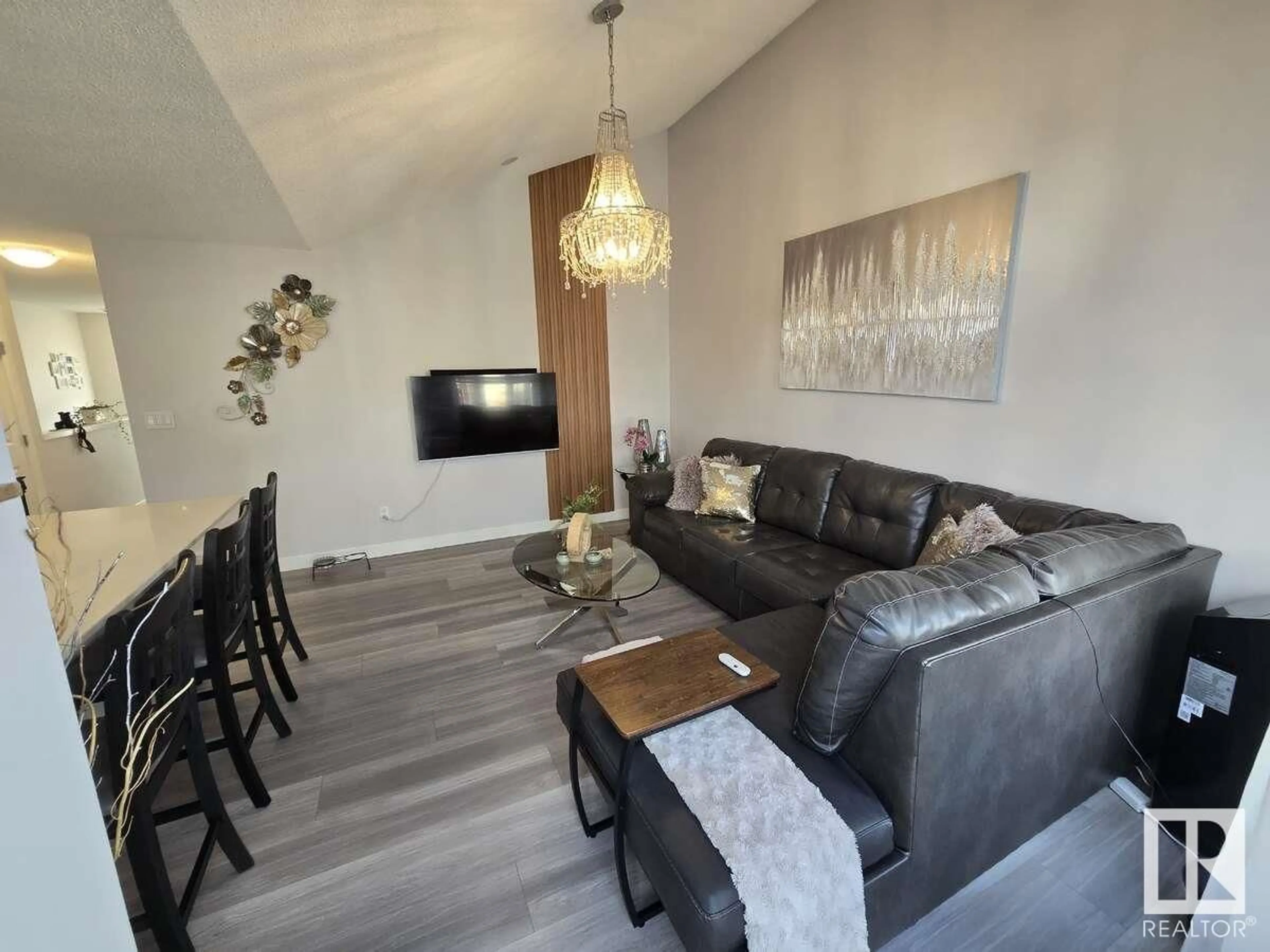Living room with furniture, wood/laminate floor for #101 - 1203 163 ST, Edmonton Alberta T6W3X1