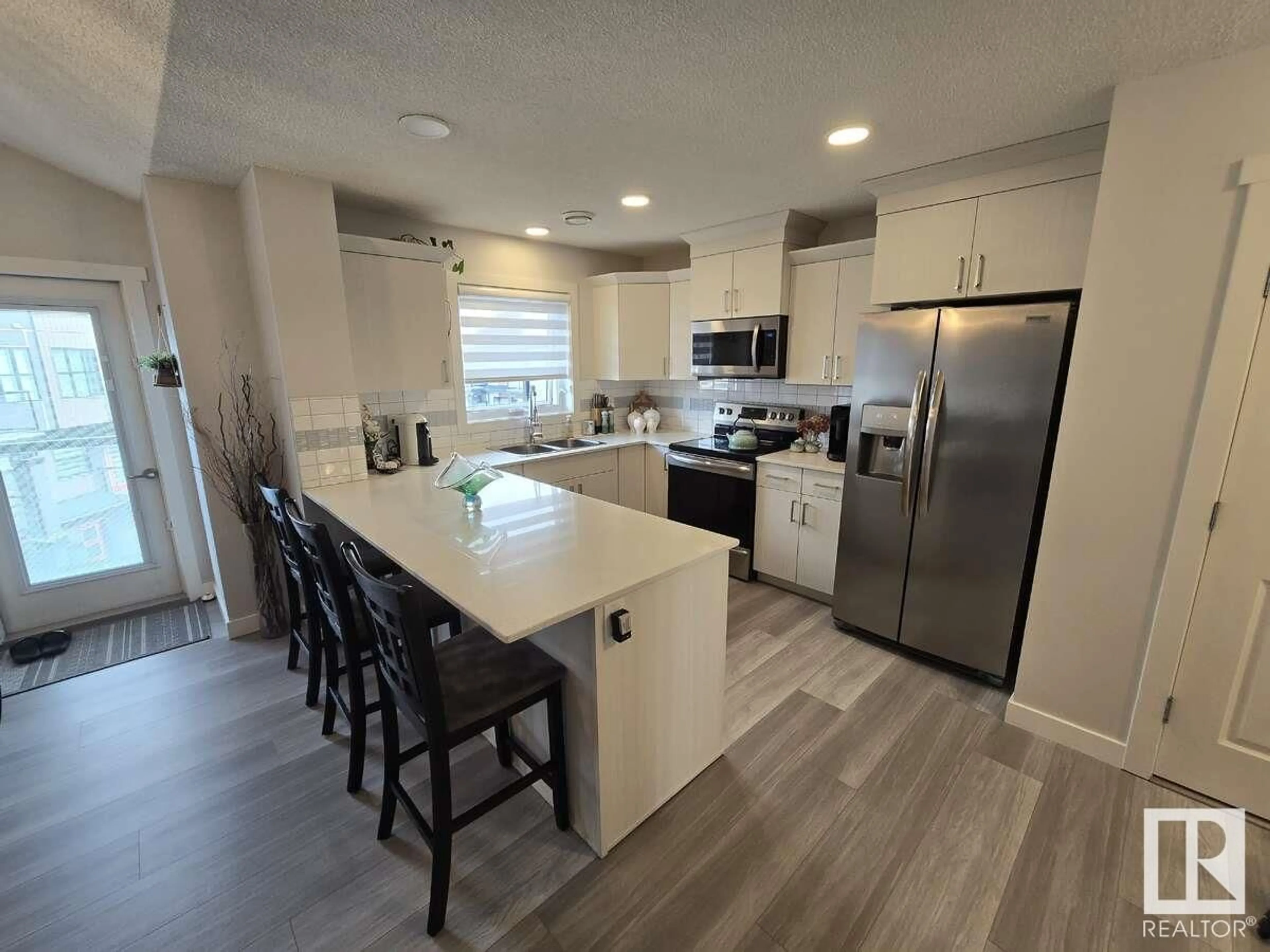 Open concept kitchen, ceramic/tile floor for #101 - 1203 163 ST, Edmonton Alberta T6W3X1