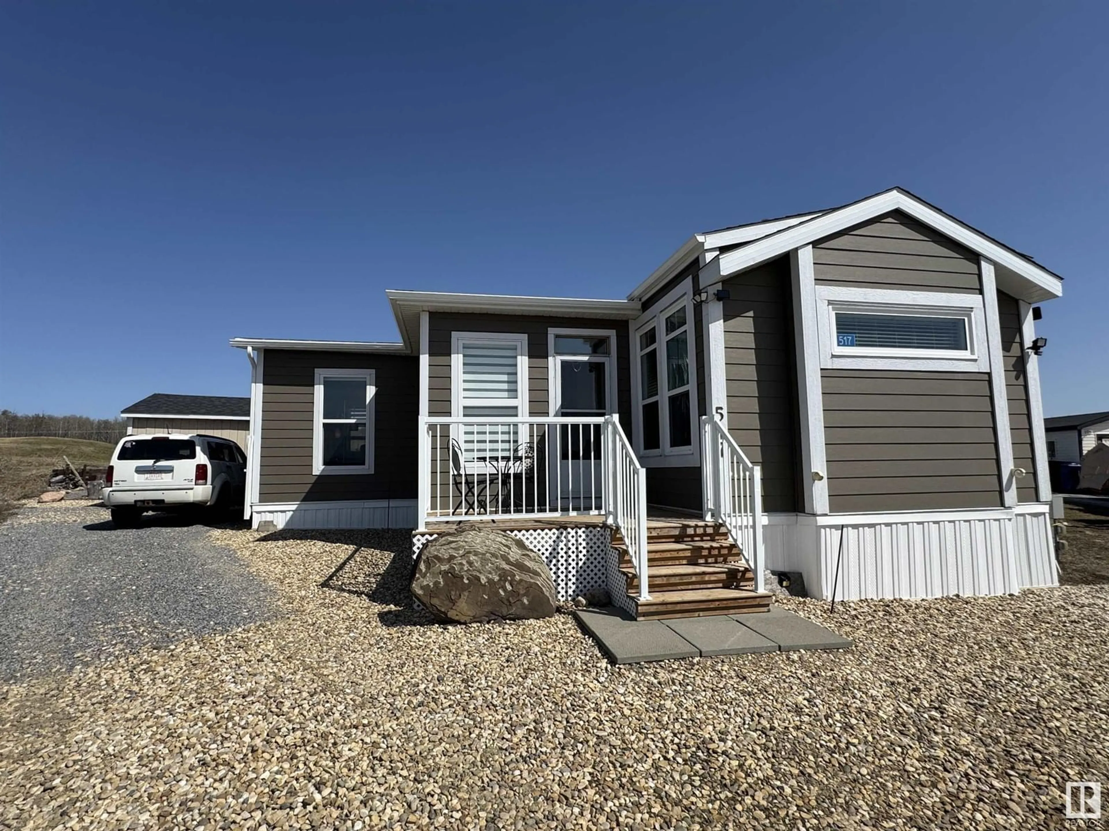 Home with vinyl exterior material, street for 454029 - 517 RGE ROAD 11, Rural Wetaskiwin County Alberta T0C2V0