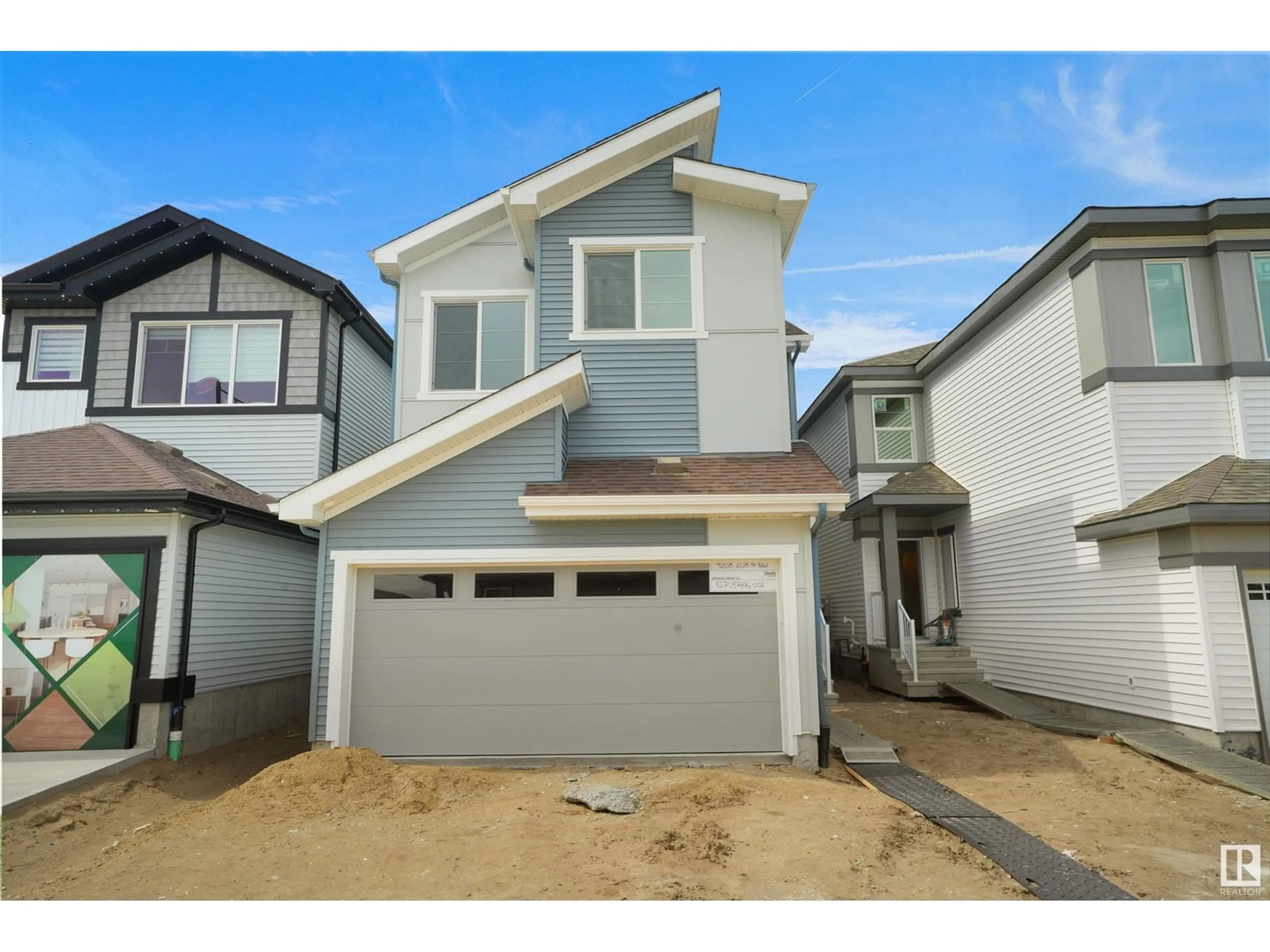 Home with vinyl exterior material, street for NW - 4208 208 ST, Edmonton Alberta T6M3E4