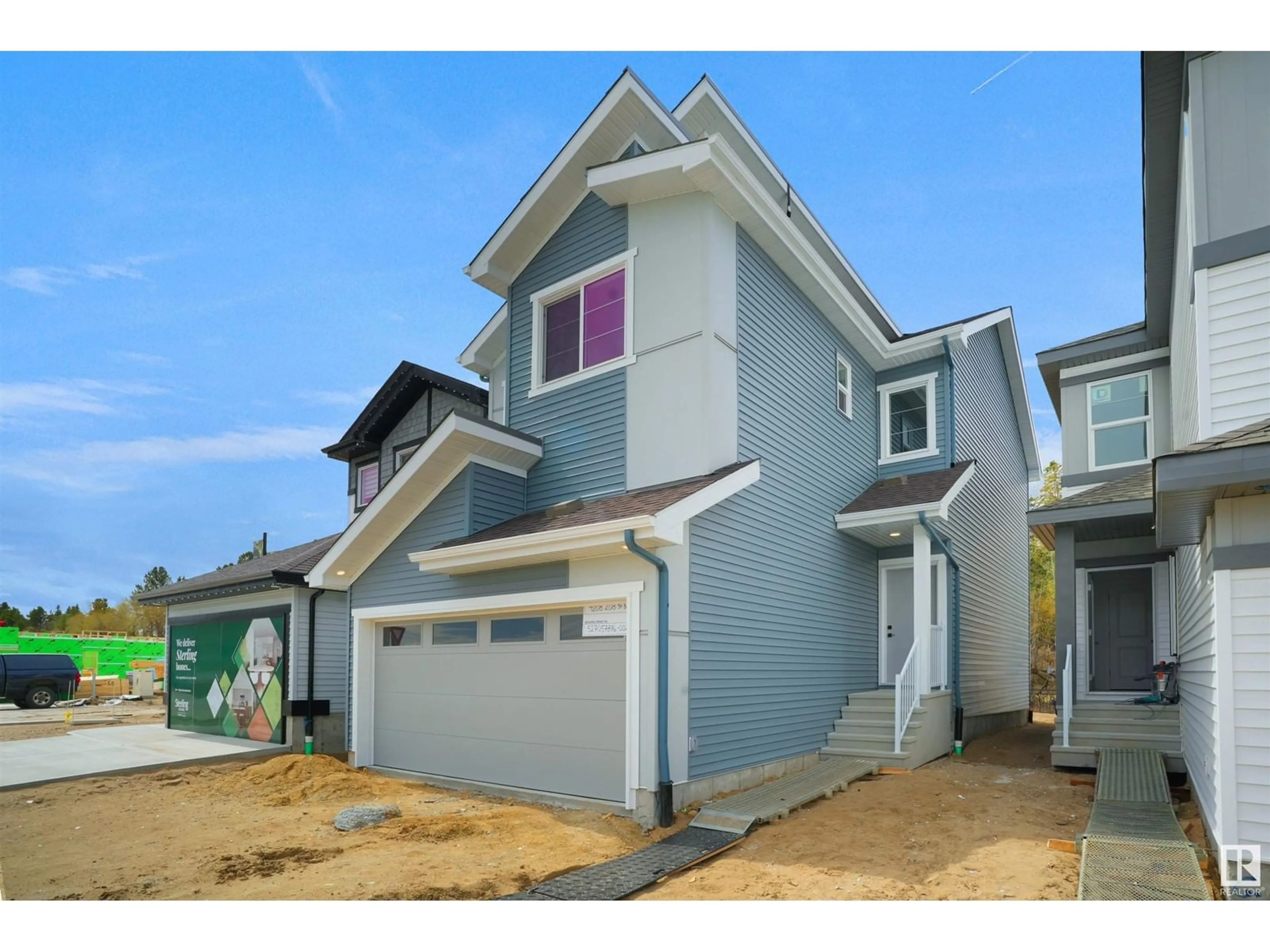 Home with vinyl exterior material, street for NW - 4208 208 ST, Edmonton Alberta T6M3E4